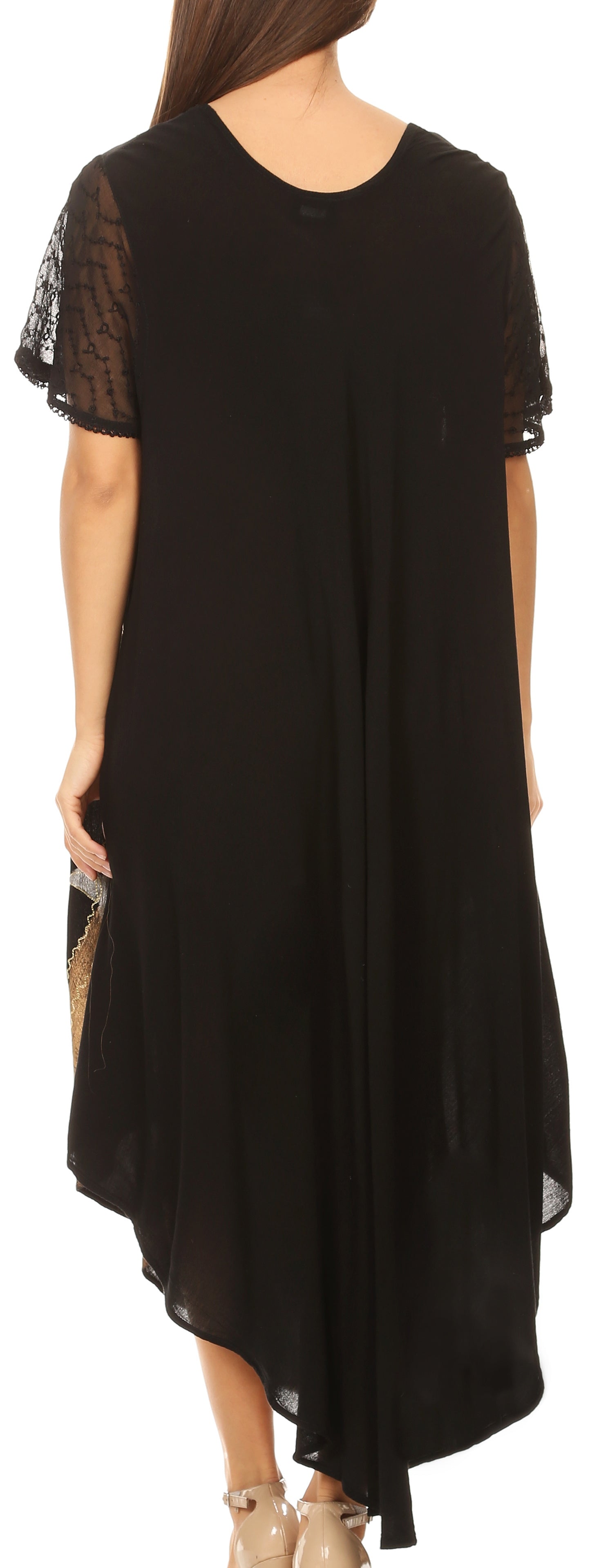 Black dress with sheer sleeves worn by a model on a white background