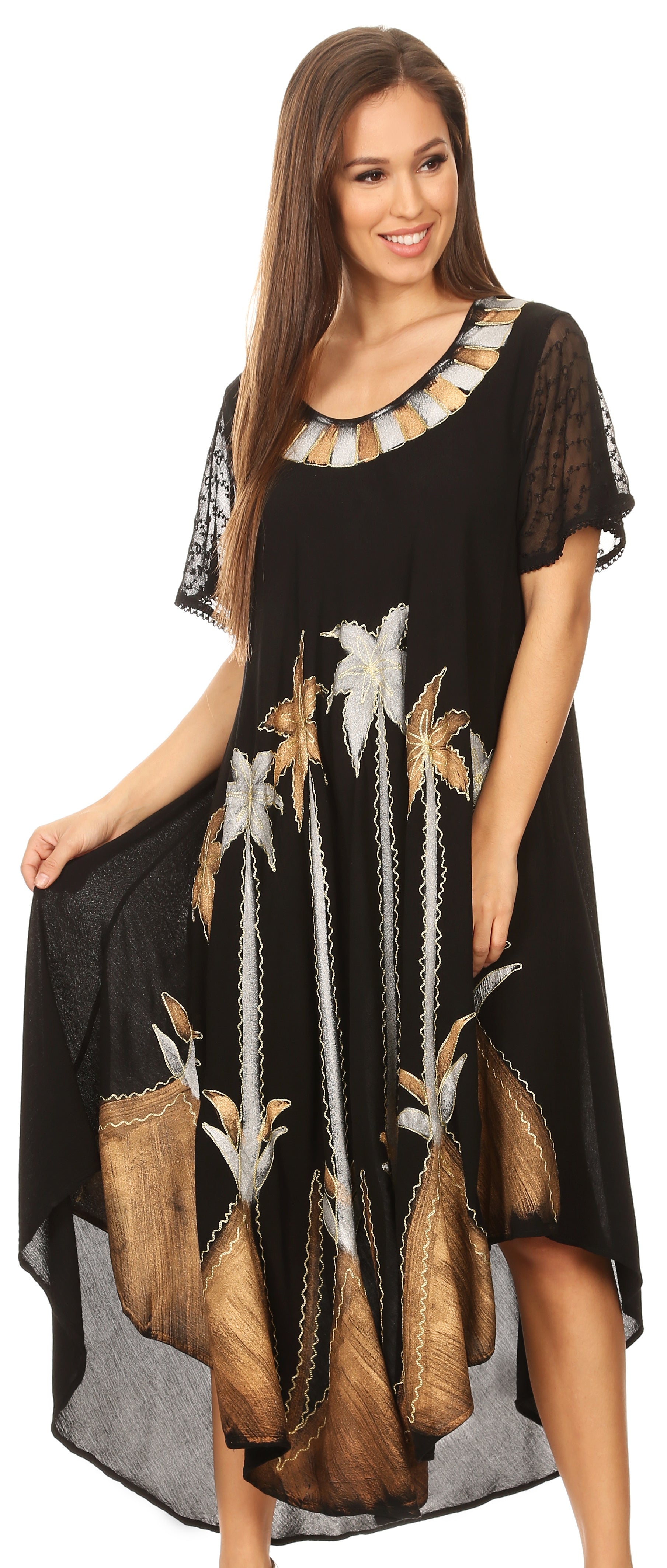 Woman wearing a black dress with floral patterns on a white background