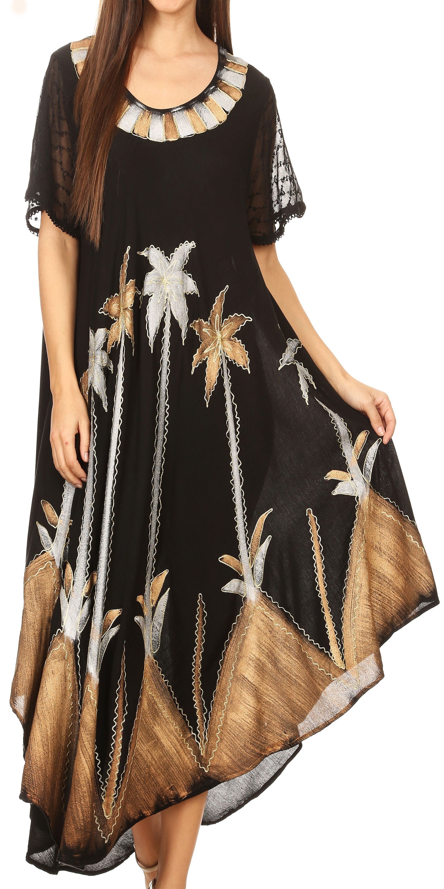 Black dress with floral patterns worn by a model on a white background