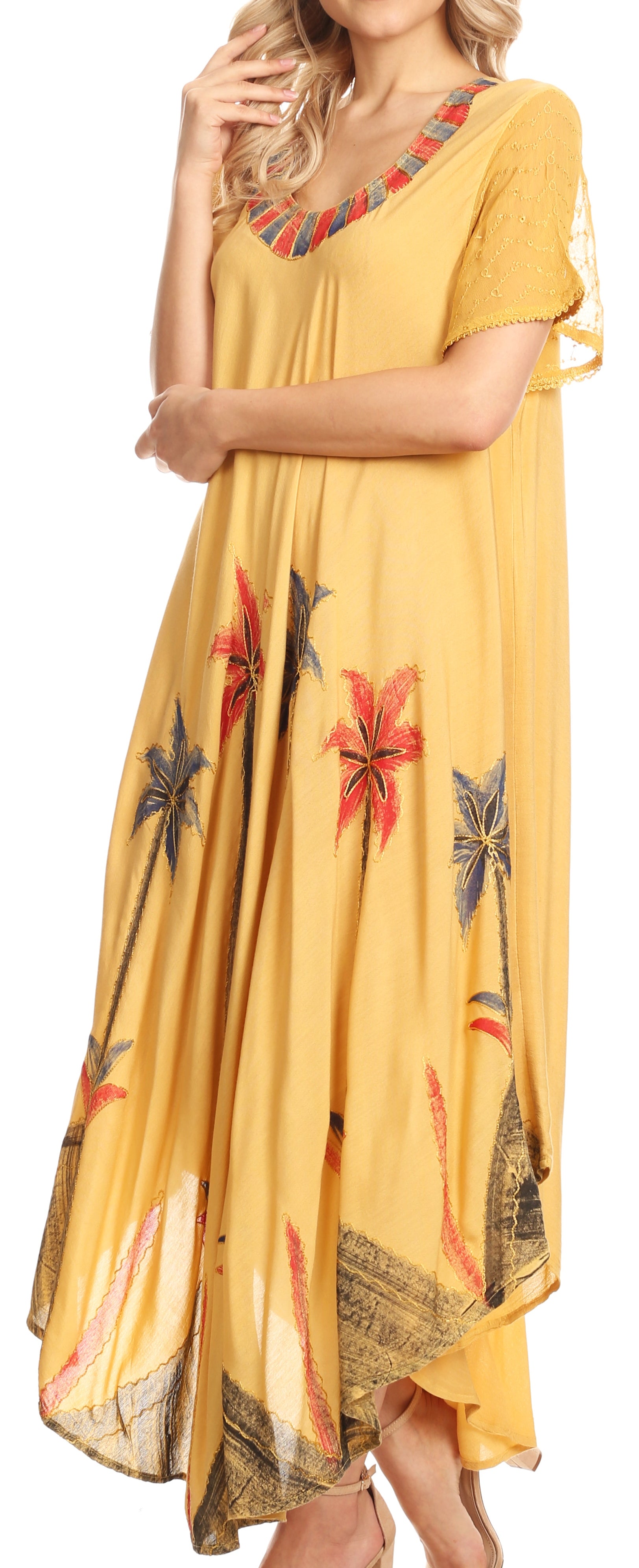 Woman wearing a yellow dress with floral patterns