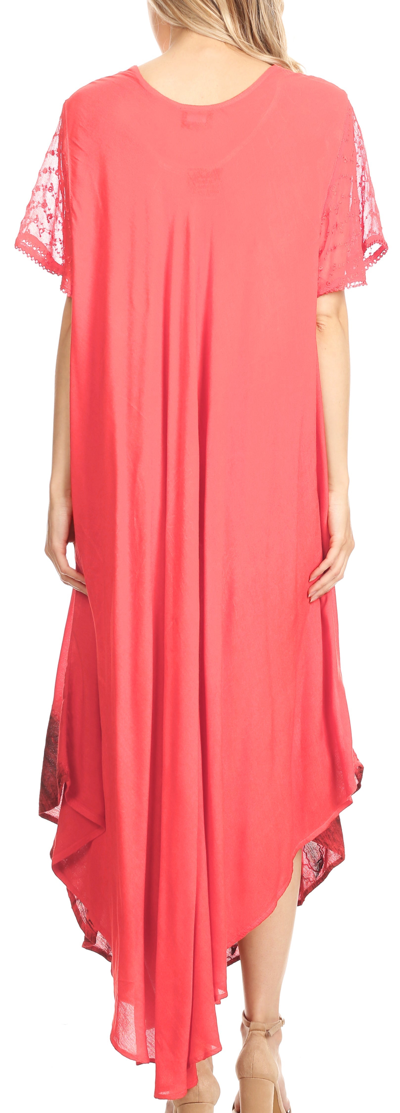 Coral dress with lace sleeves and hem, worn by a model.