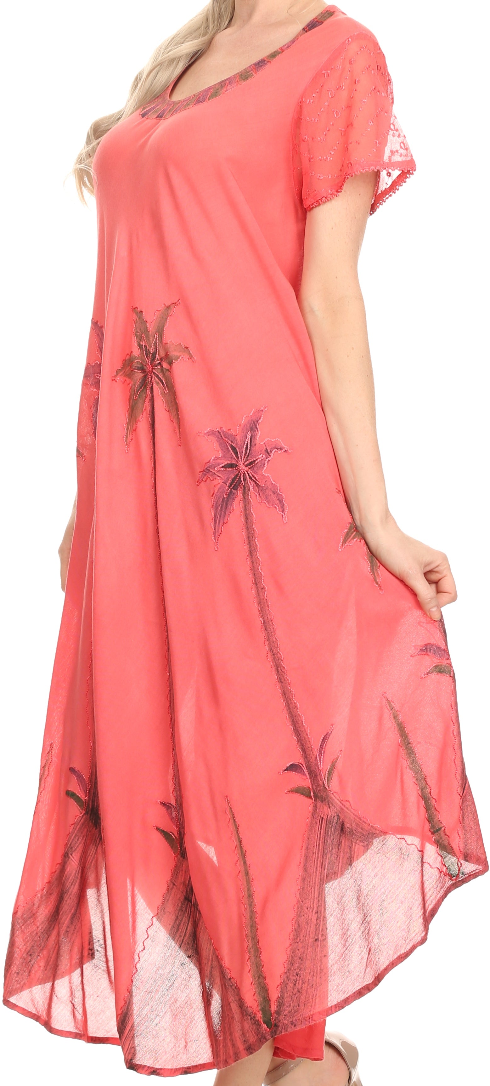 Coral dress with floral patterns on a plain background