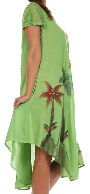 Green dress with tropical designs on a white background