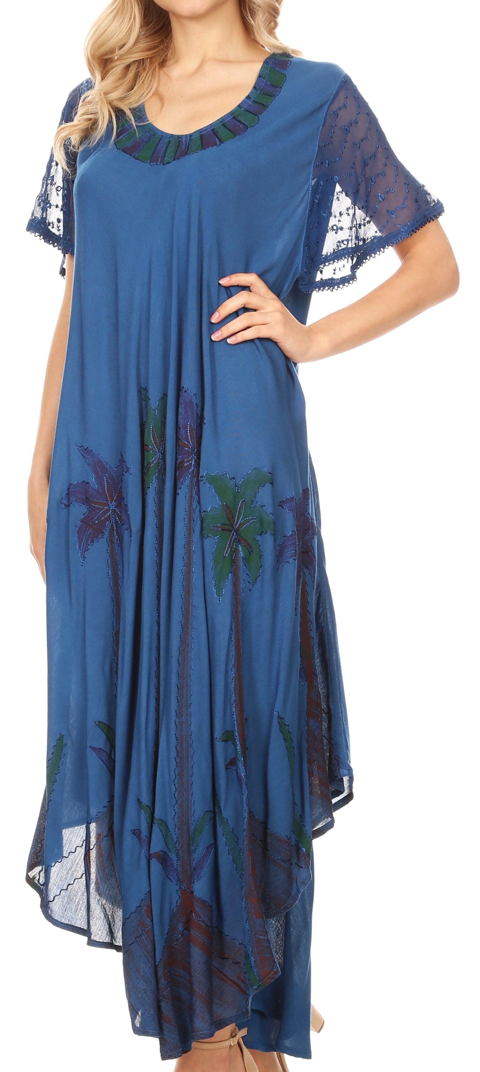 Woman wearing a blue dress with floral patterns