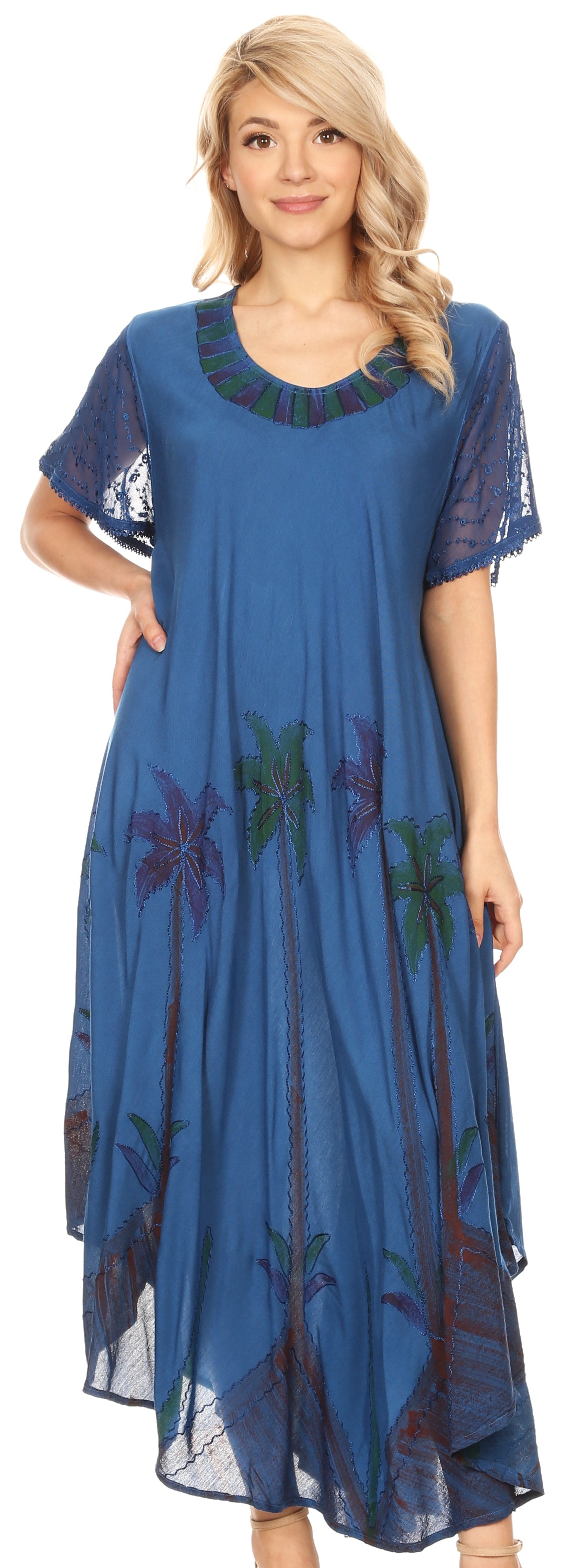 Woman wearing a blue dress with floral patterns on a white background