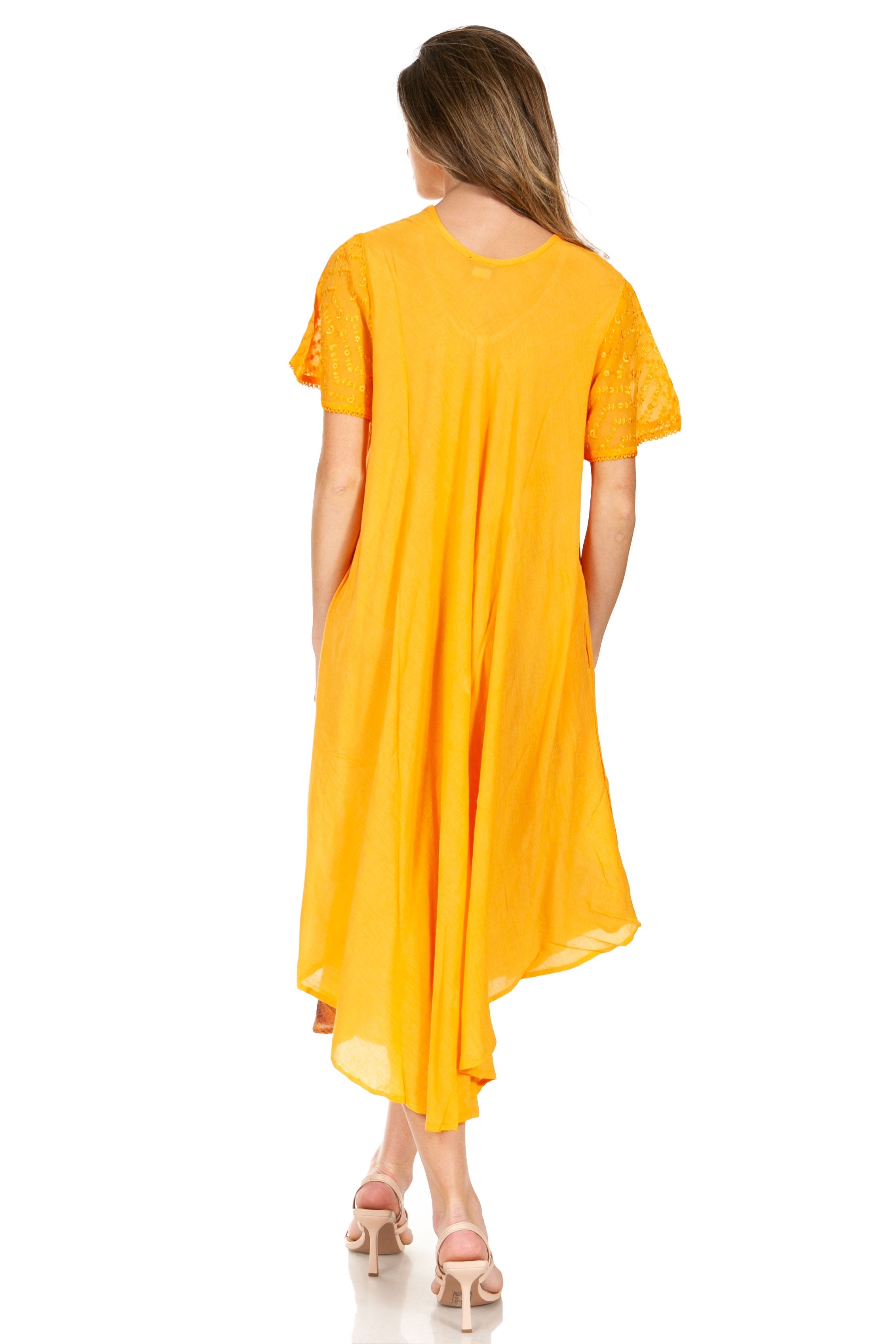 Woman wearing a yellow dress on a white background