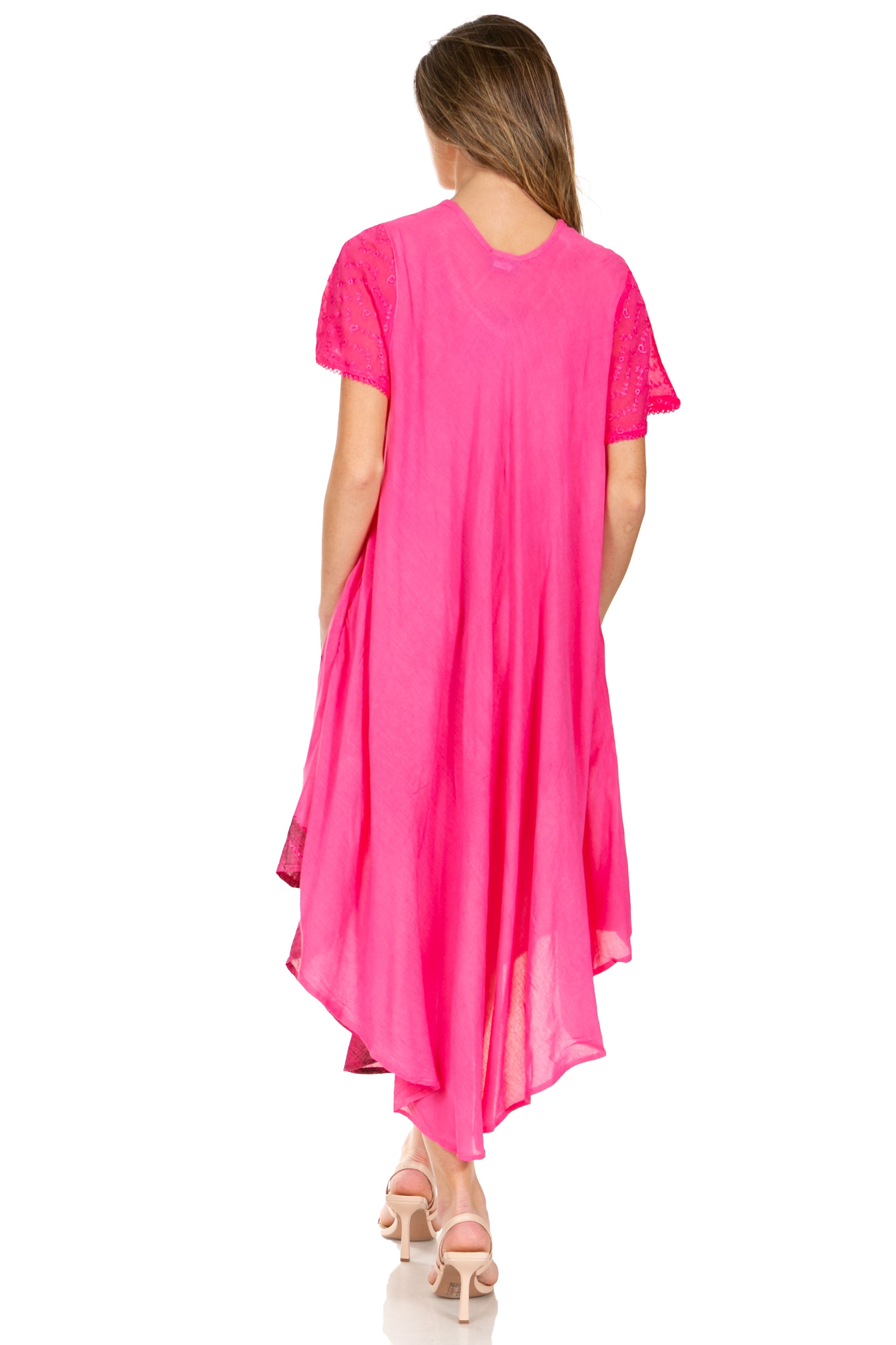 Woman wearing a bright pink dress on a white background