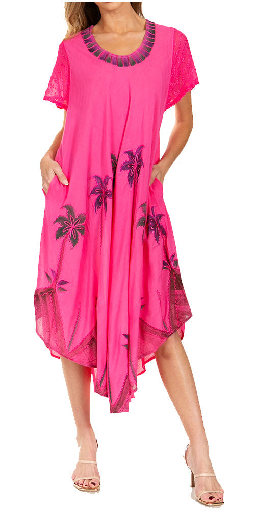 Woman wearing a bright pink dress with floral patterns on a white background
