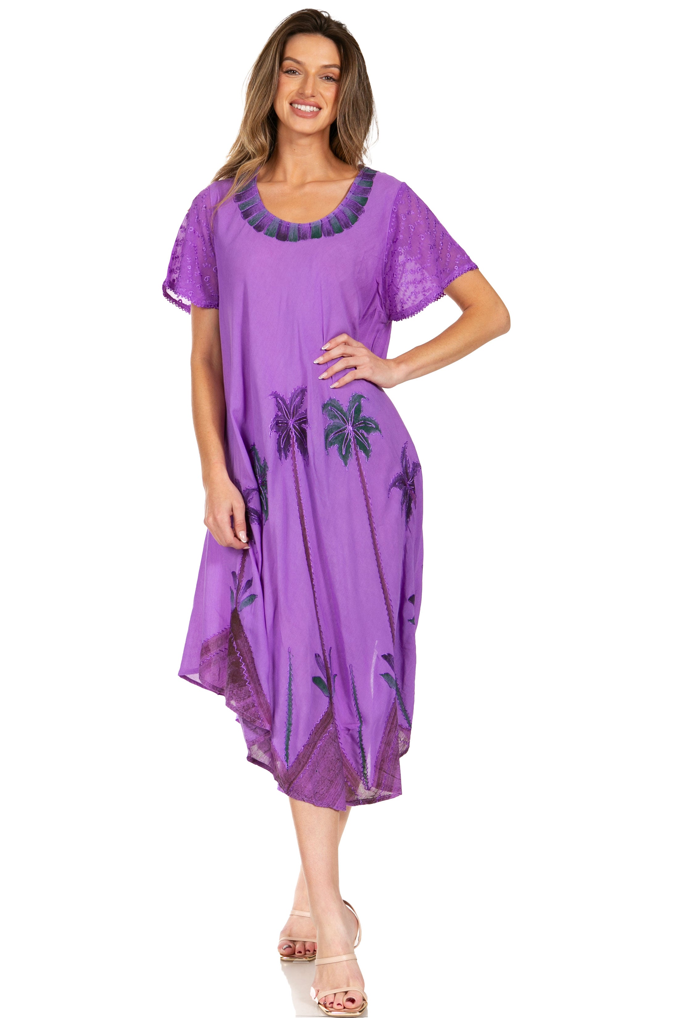 Woman wearing a purple dress with floral patterns on a white background