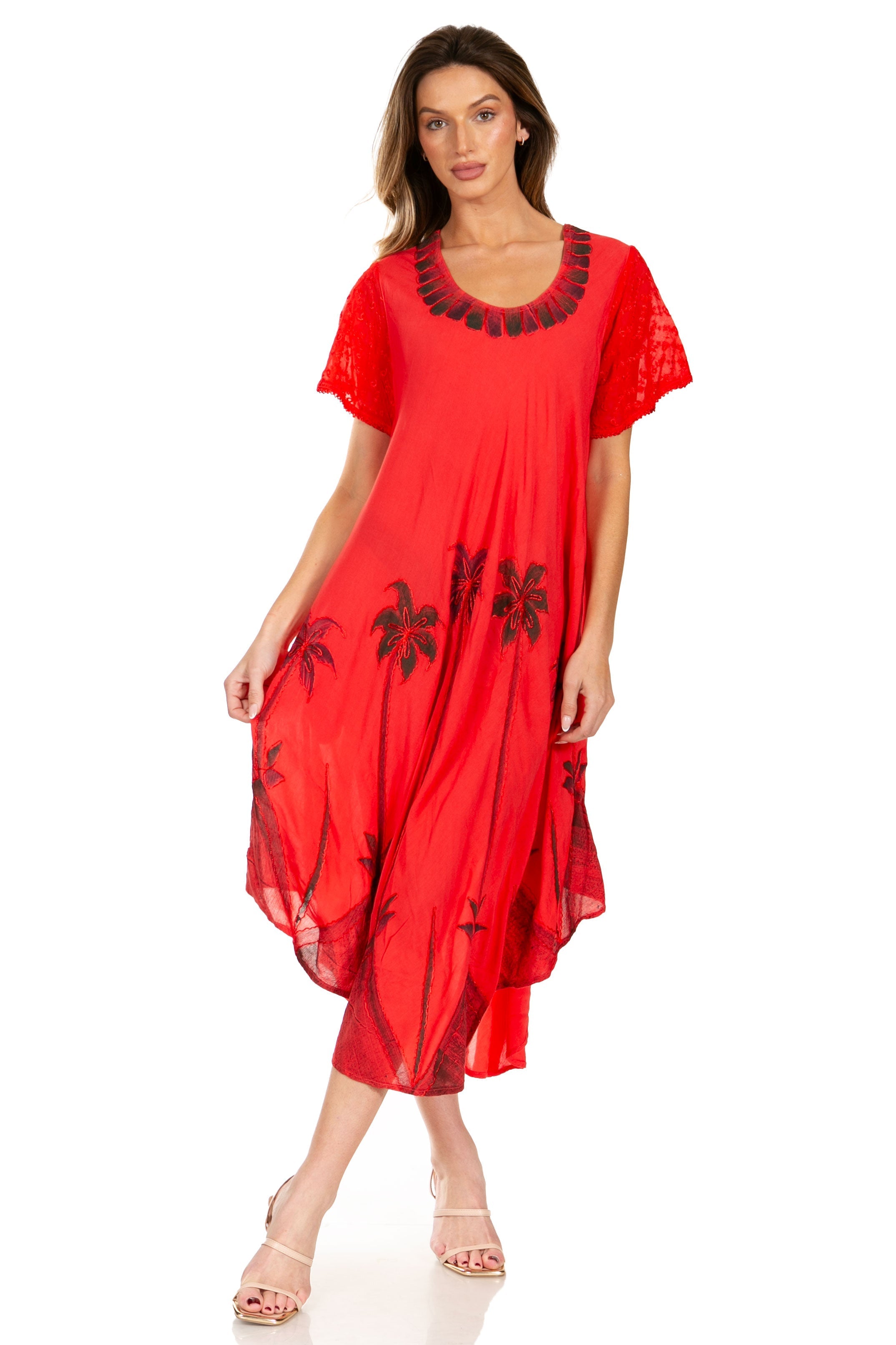 Woman wearing a red dress with black embroidery on a white background
