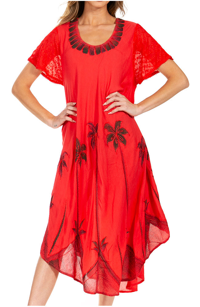 Red dress with black palm tree patterns worn by a model on a white background