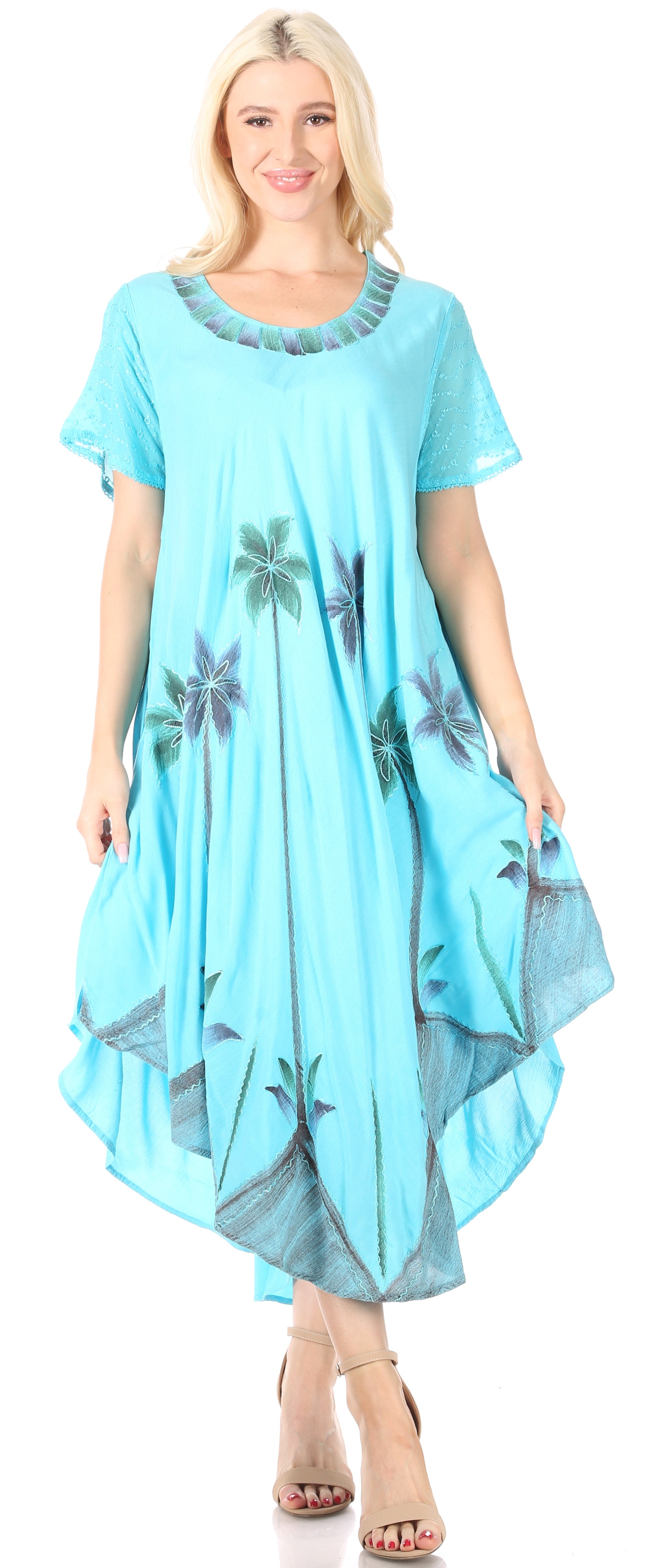Woman wearing a light blue dress with palm tree patterns on a white background