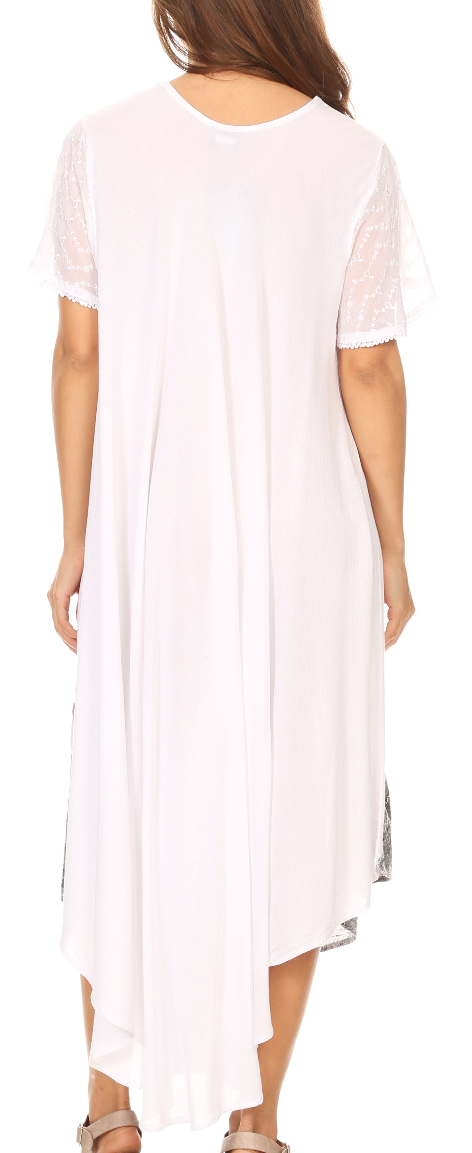 White dress with sheer sleeves worn by a person