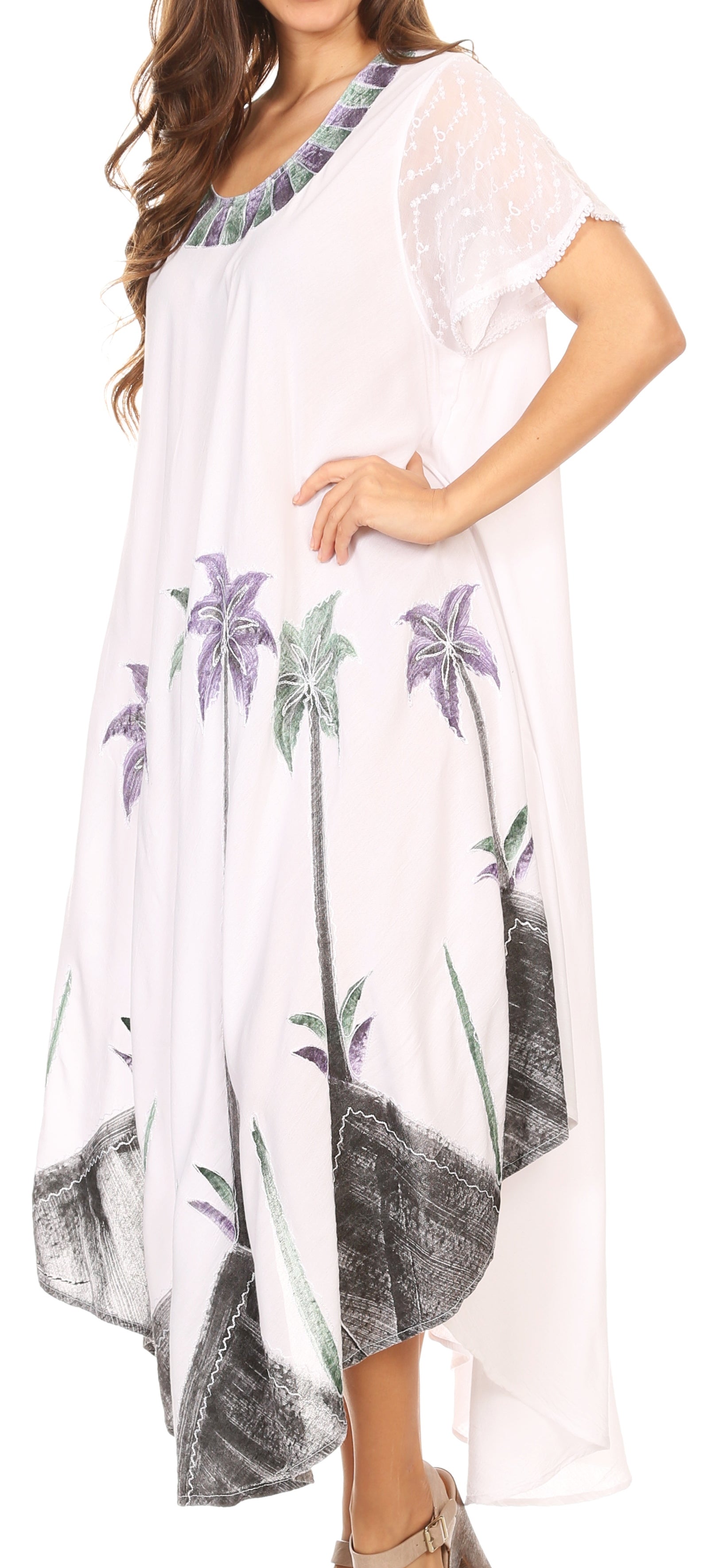 White dress with floral patterns on a plain background