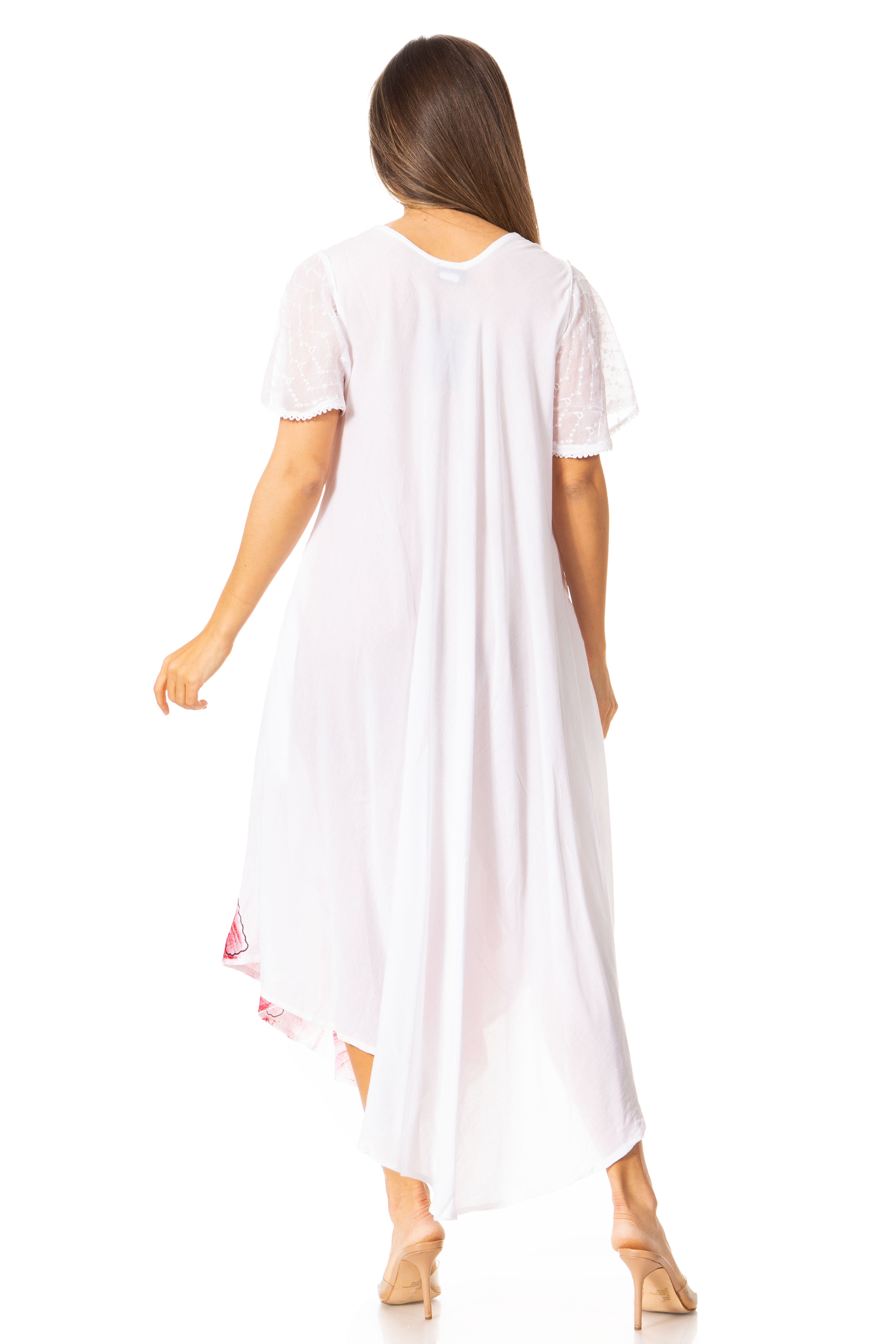 Woman wearing a white dress with a subtle pattern on a white background