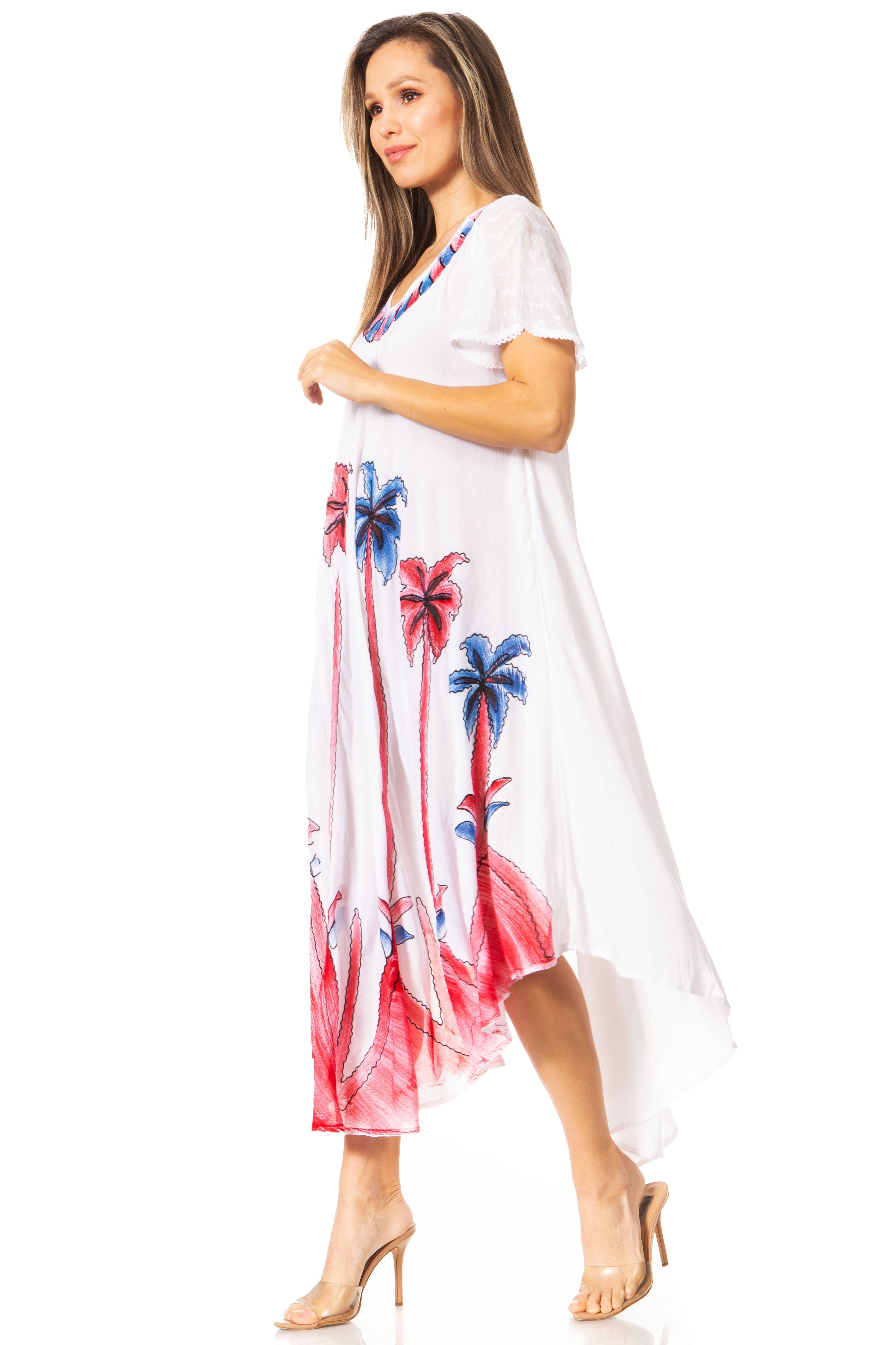 Woman wearing a white dress with colorful palm tree patterns on a white background