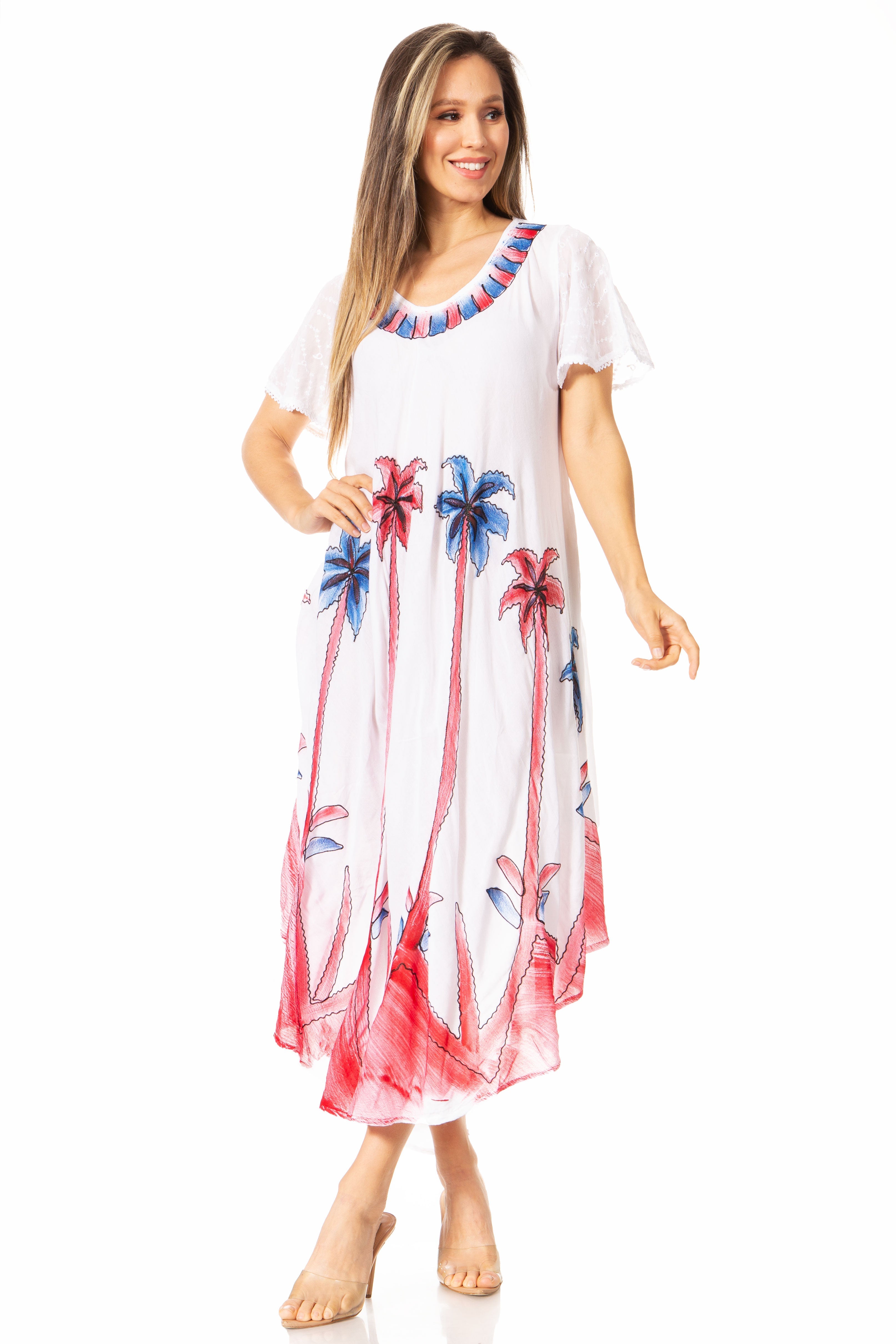 Woman wearing a white dress with colorful floral patterns on a white background