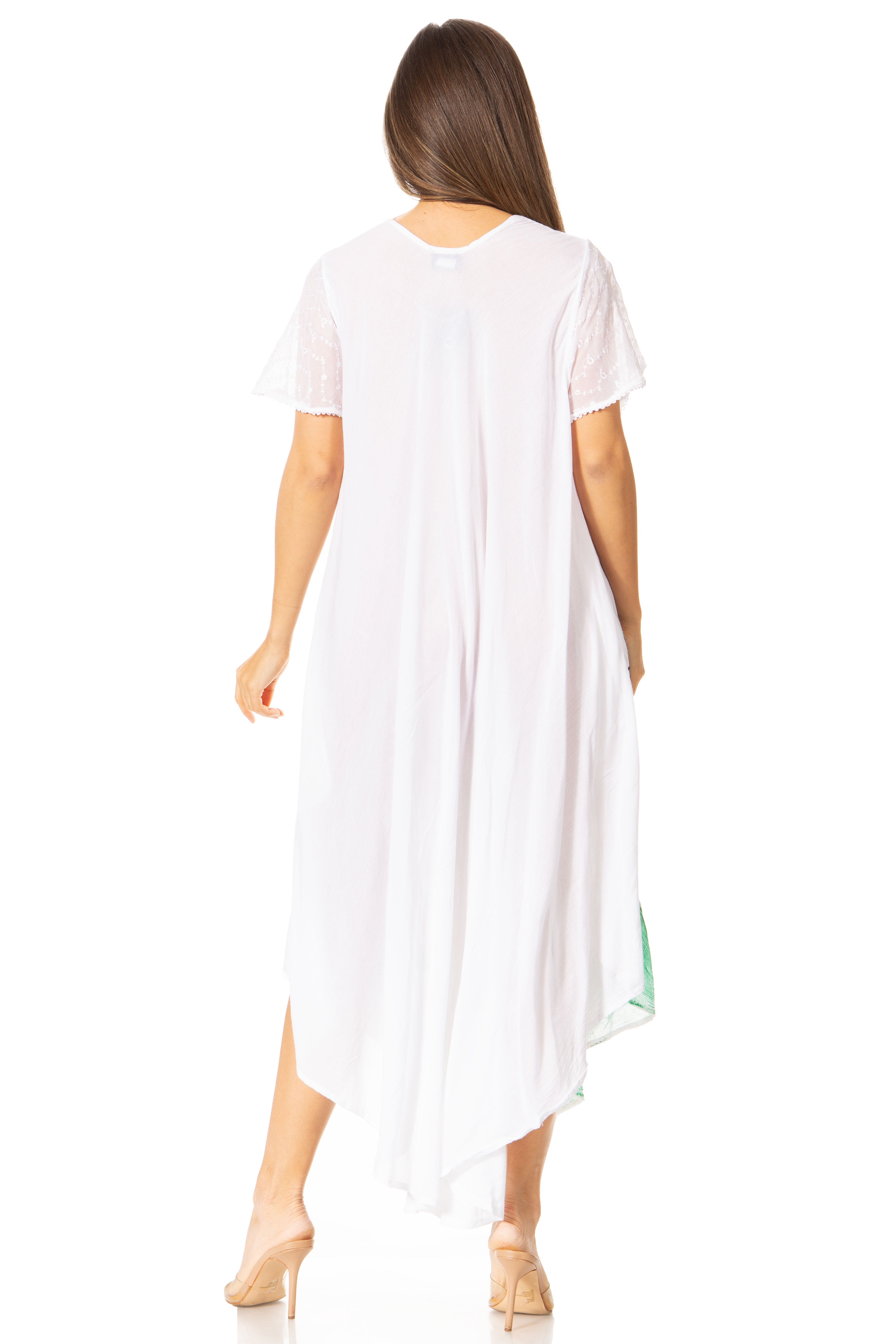 Woman wearing a white dress with a slit on a white background
