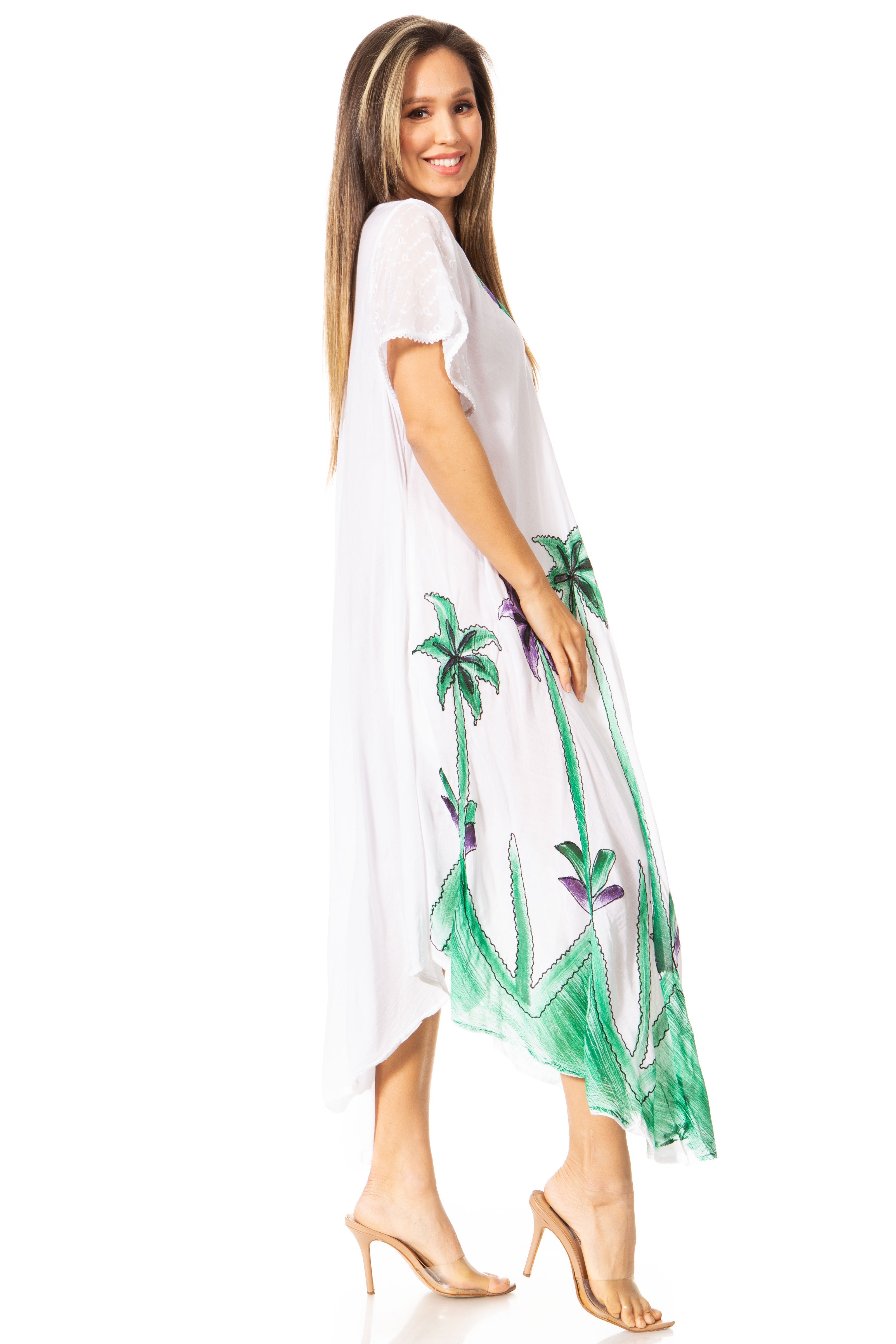 Woman wearing a white dress with green palm tree designs on a white background