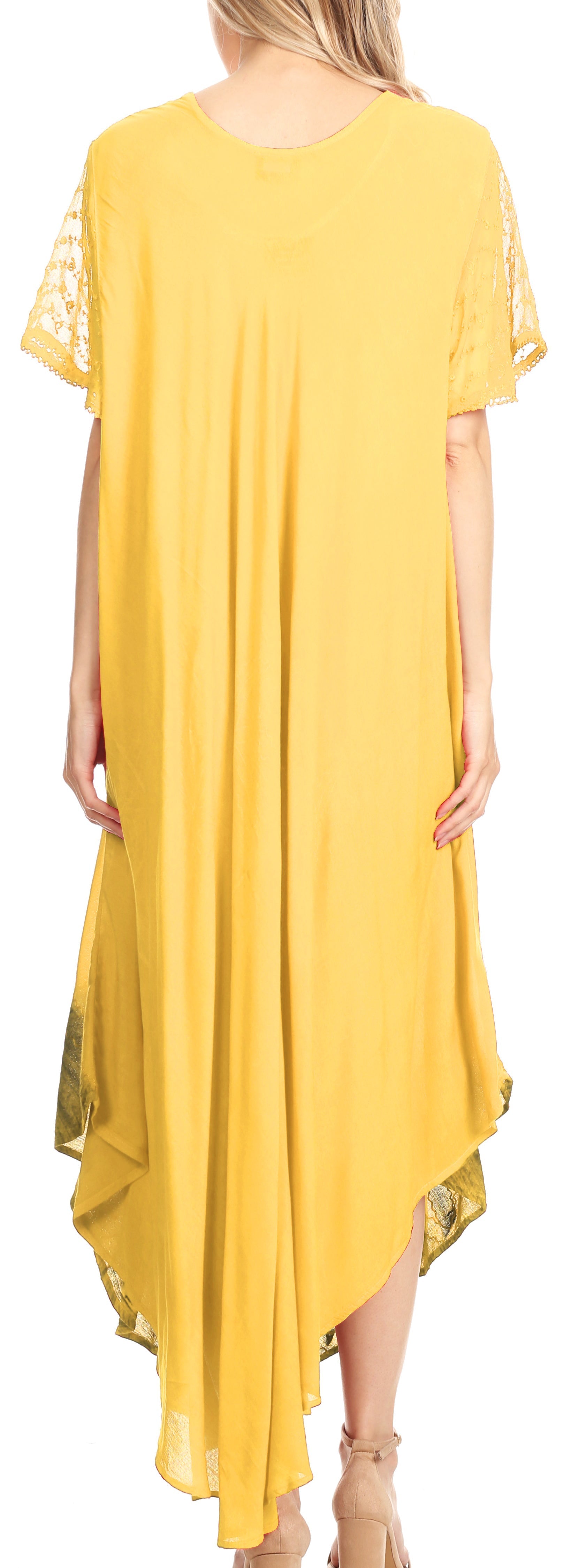Yellow dress with lace sleeves and hem, worn by a model.