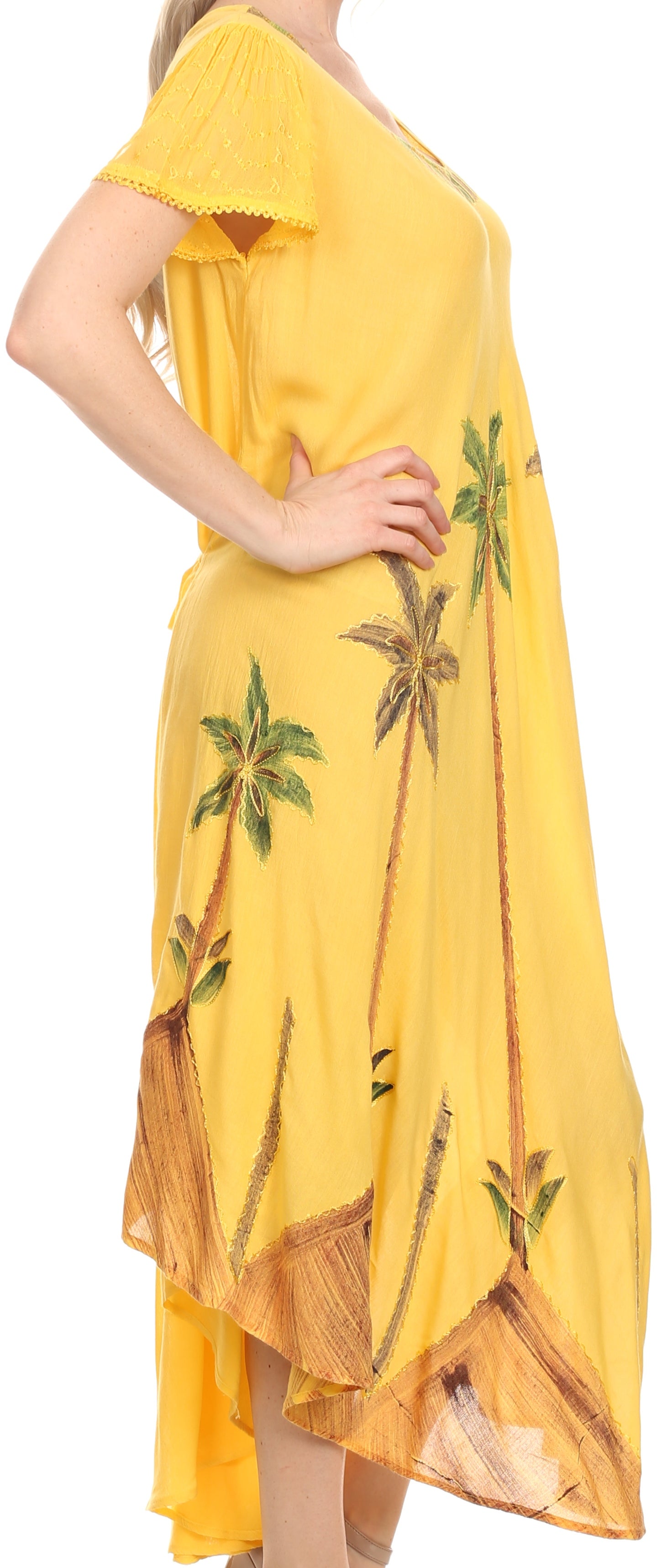 Yellow dress with palm tree design worn by a person