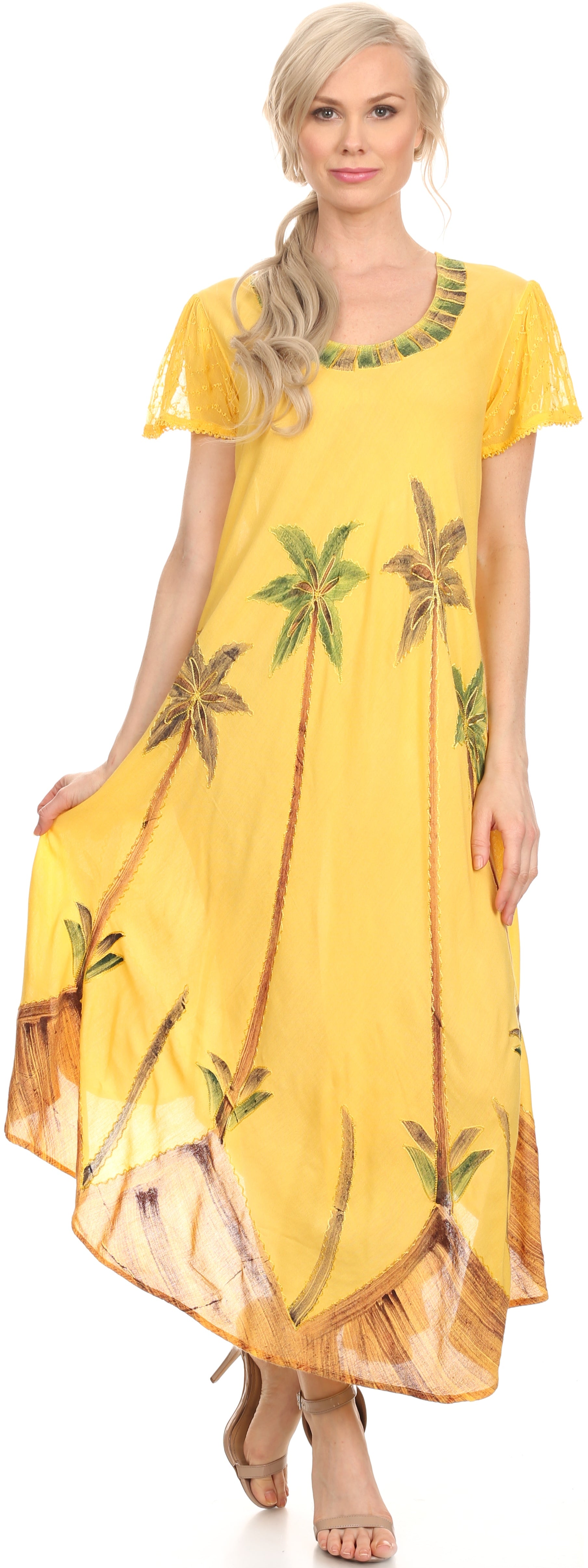 Woman wearing a yellow dress with palm tree patterns on a white background