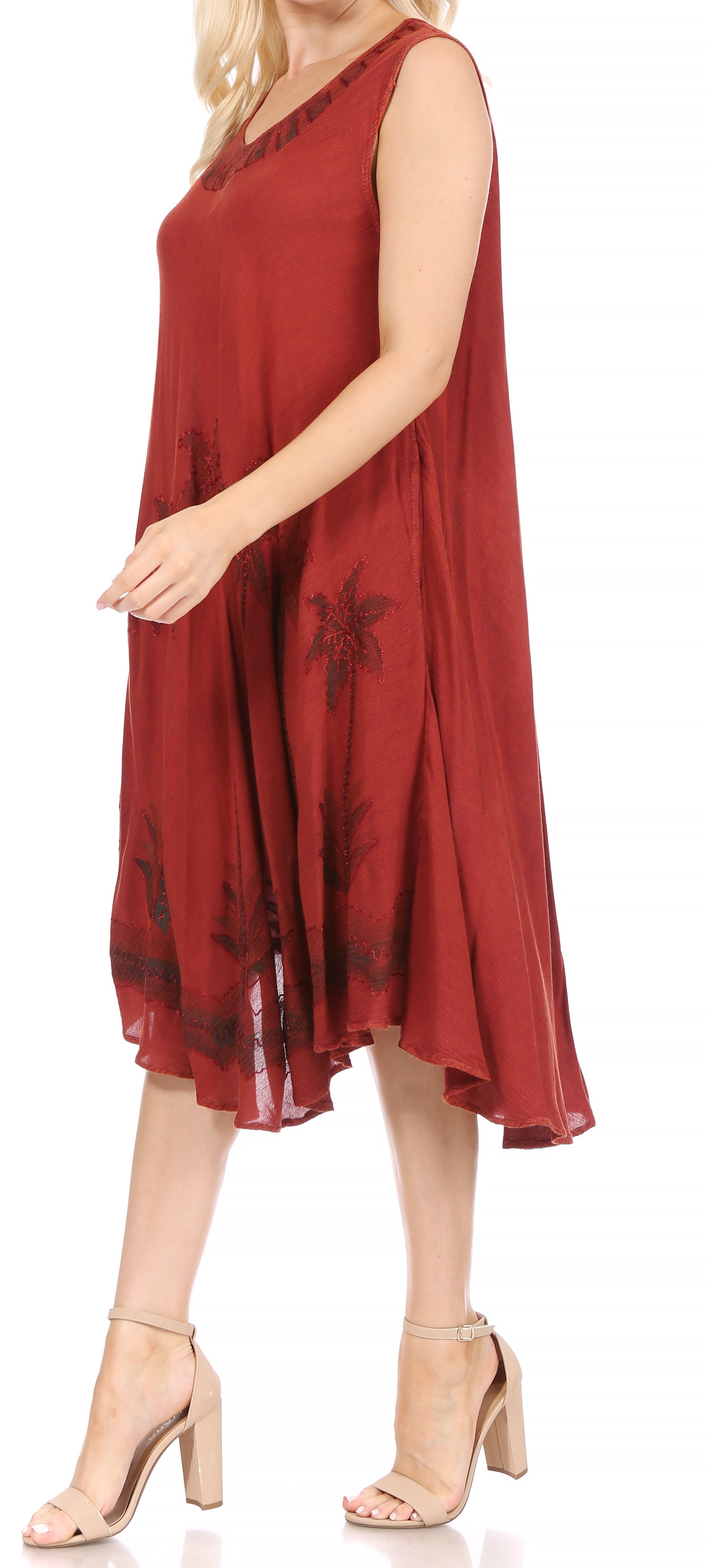 Red dress with floral pattern worn by a model on a white background