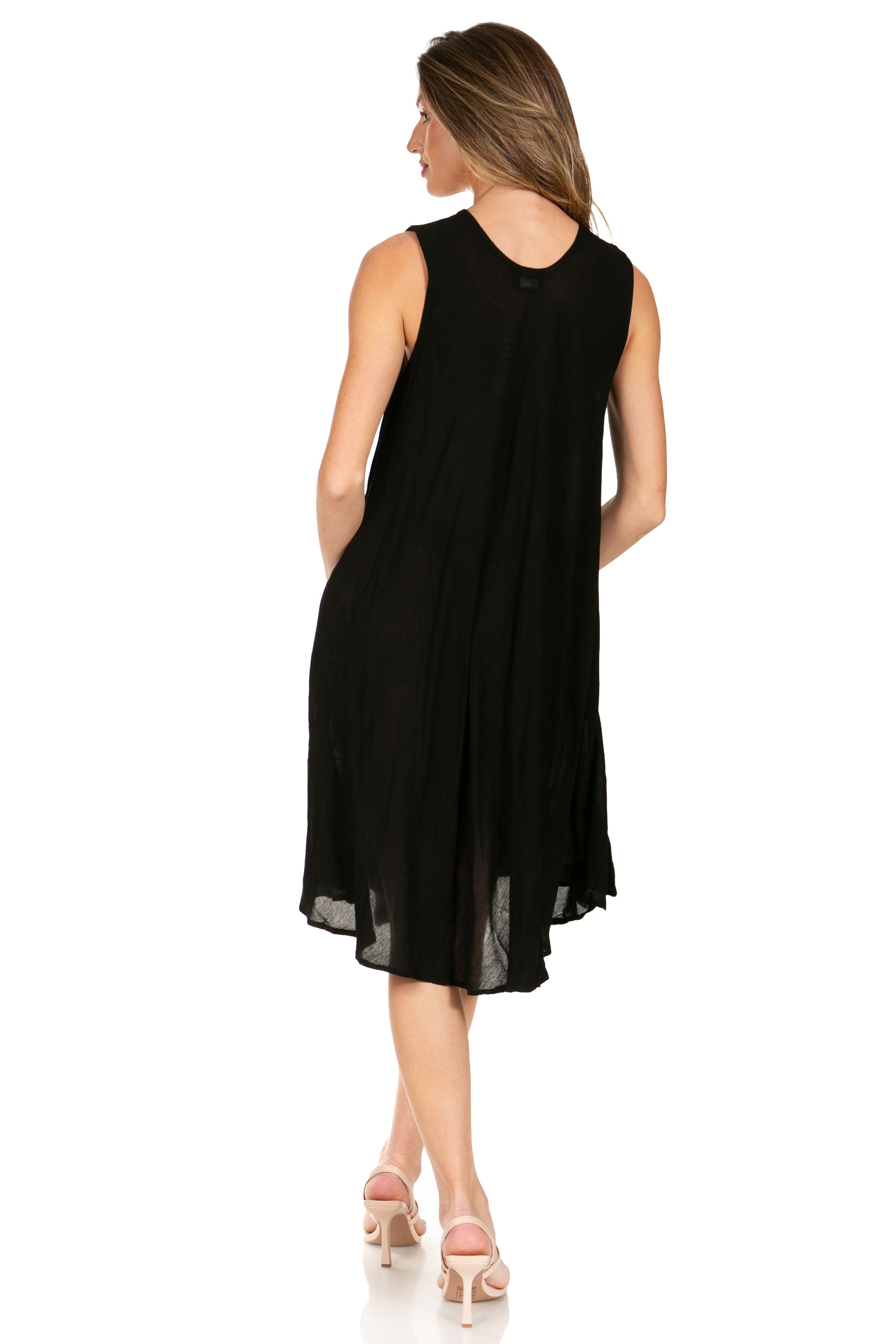 Woman wearing a black sleeveless dress on a white background