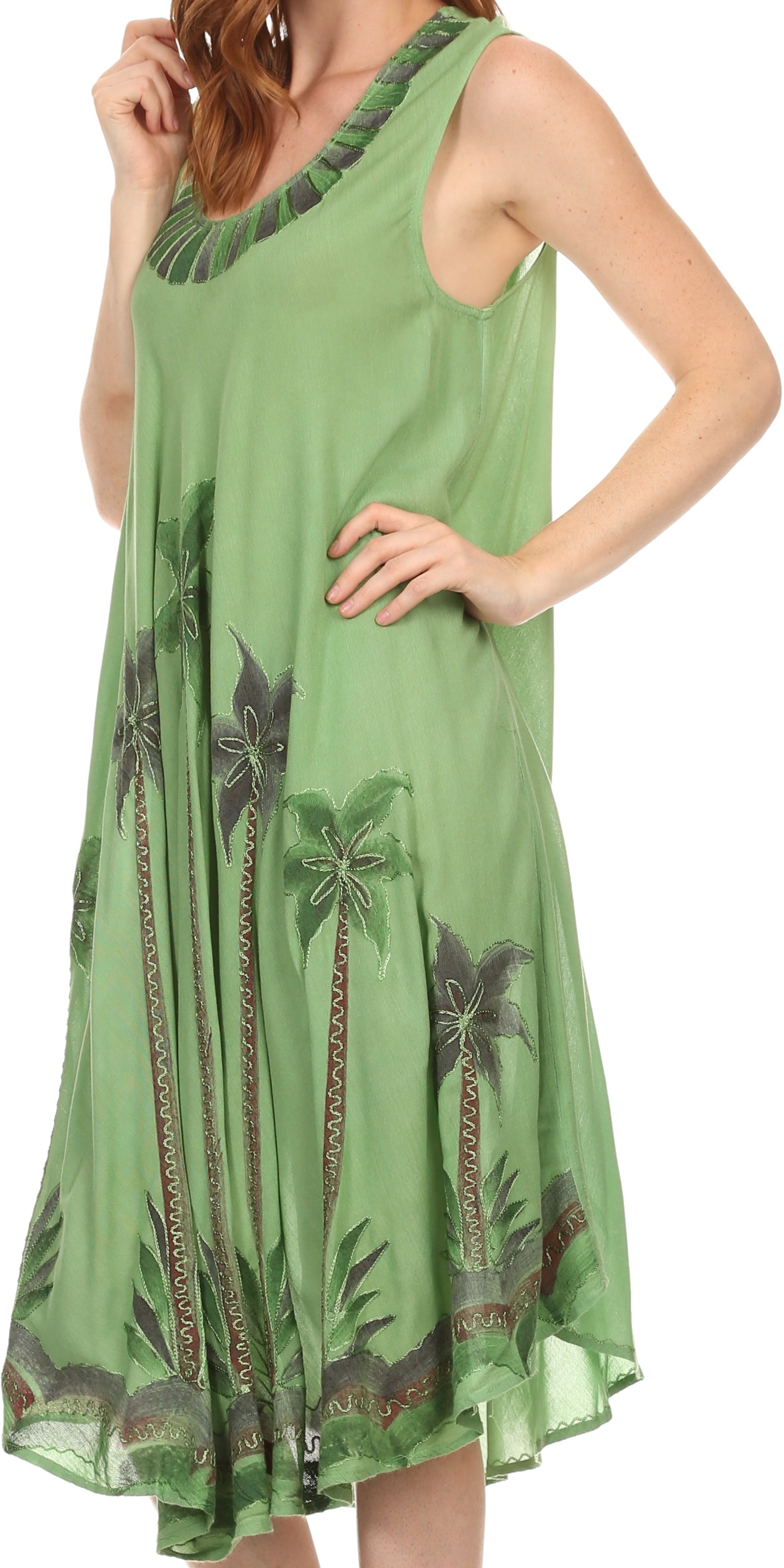 Green dress with palm tree patterns on a white background