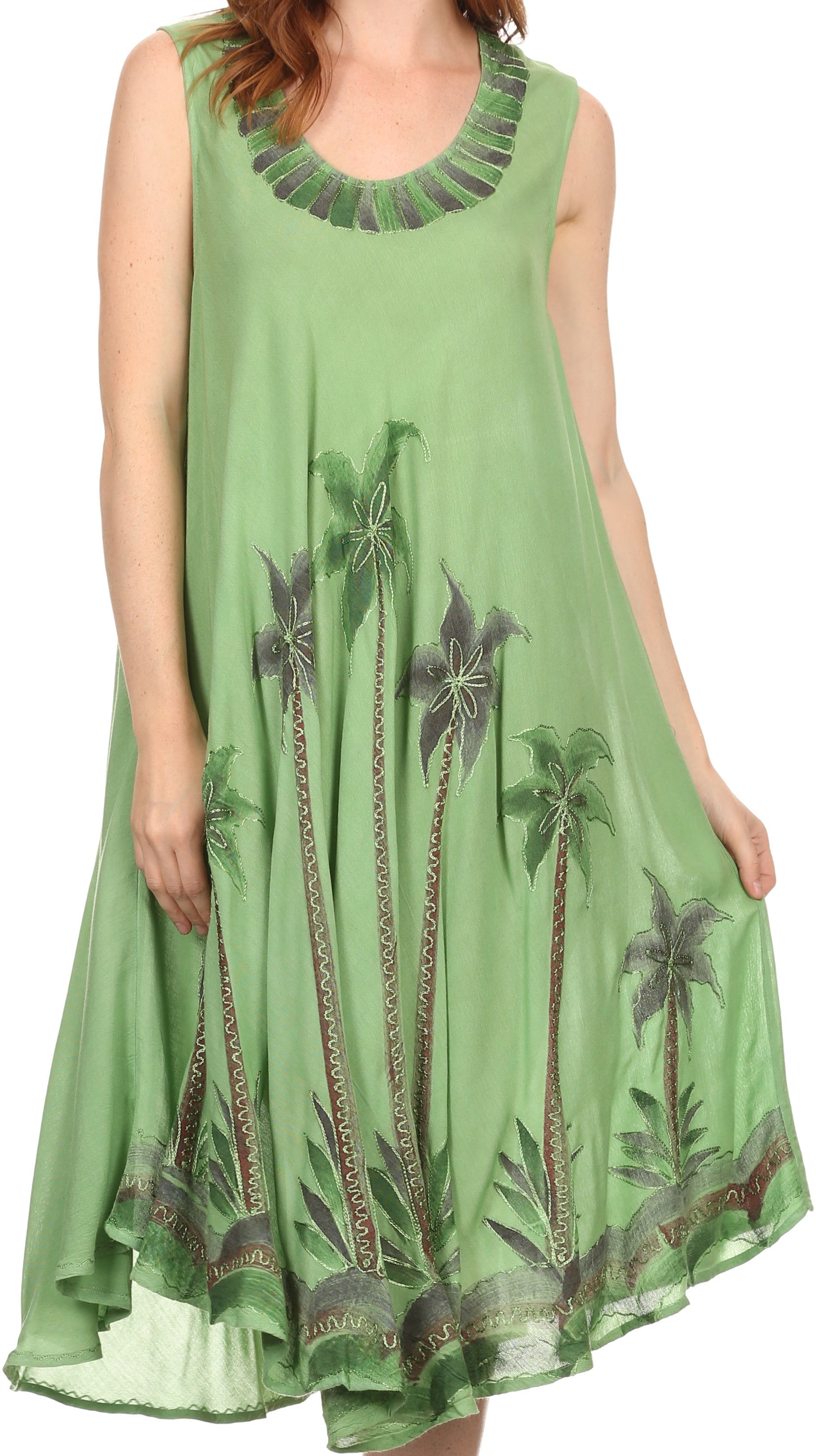 Green dress with palm tree design on a white background