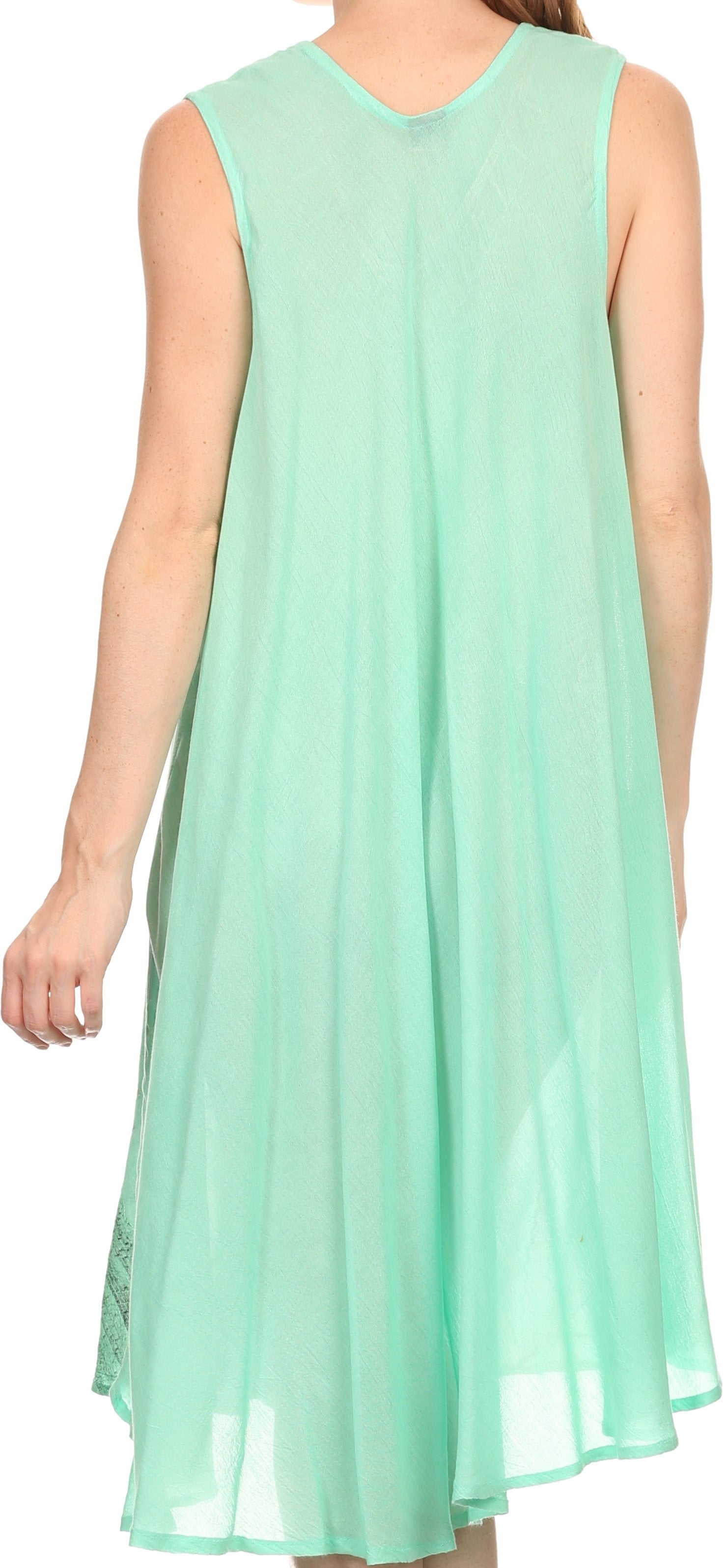 Mint green sleeveless dress worn by a person