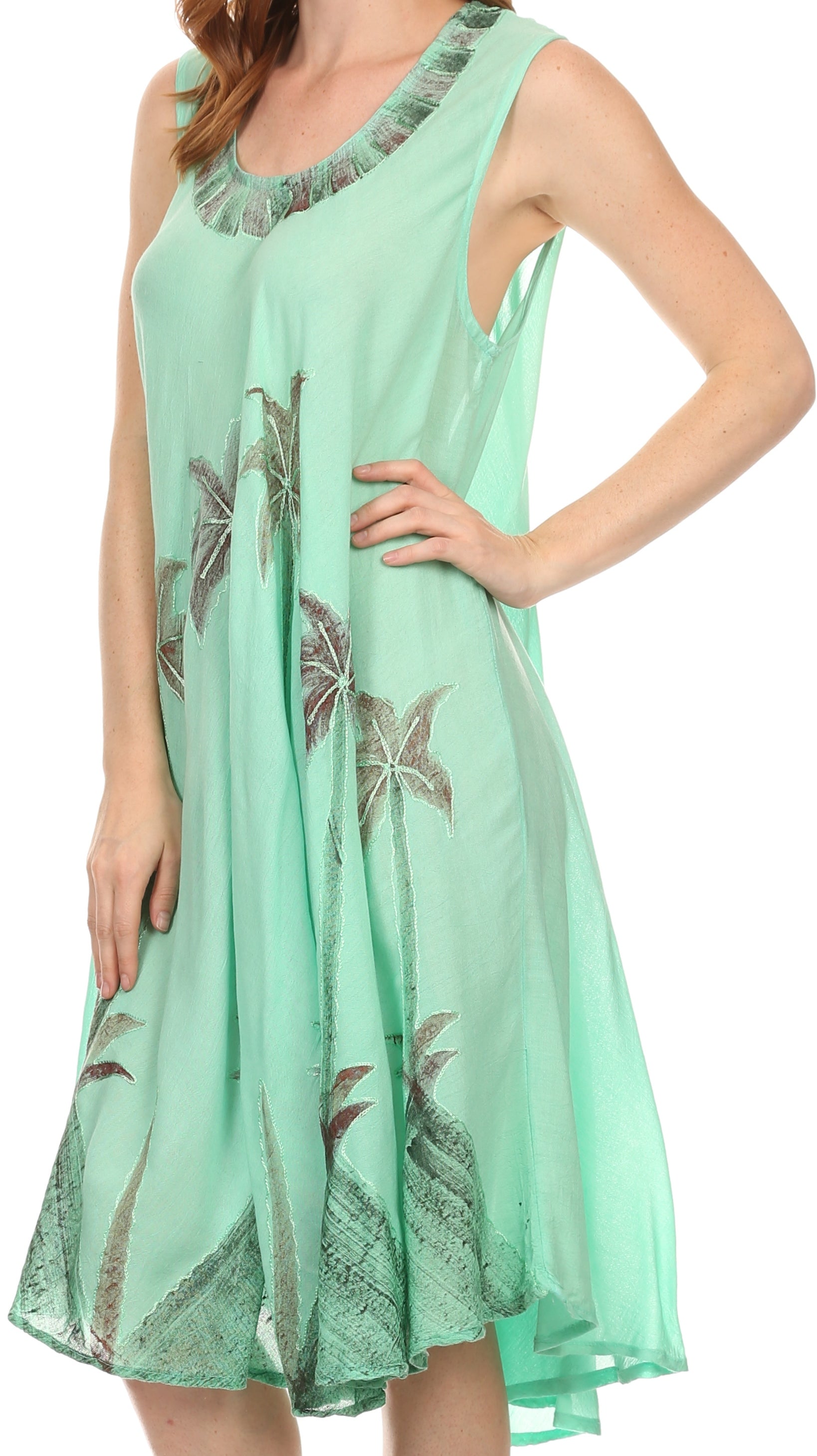Mint green dress with floral patterns on a white background