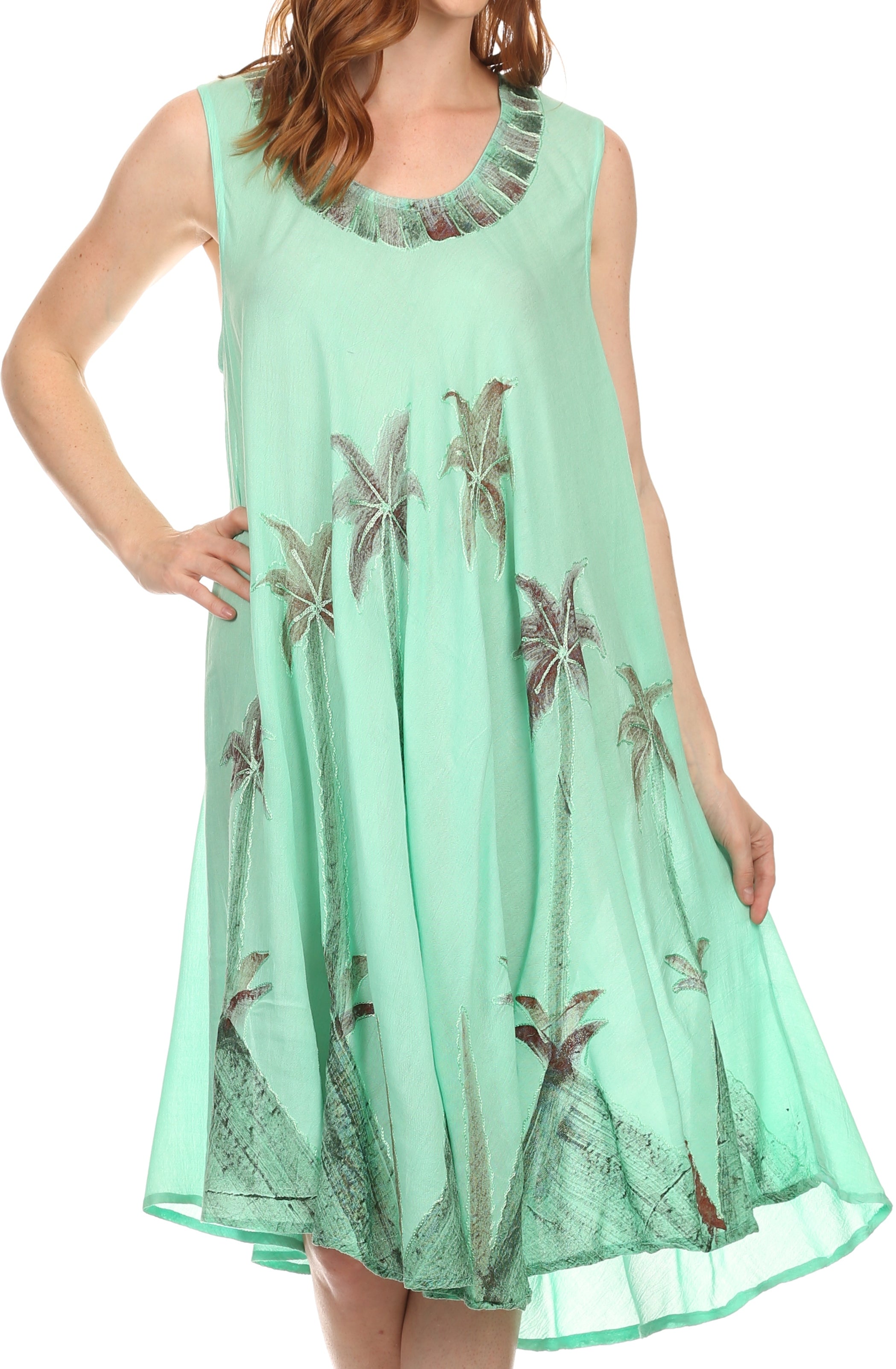 Mint green dress with palm tree patterns on a white background