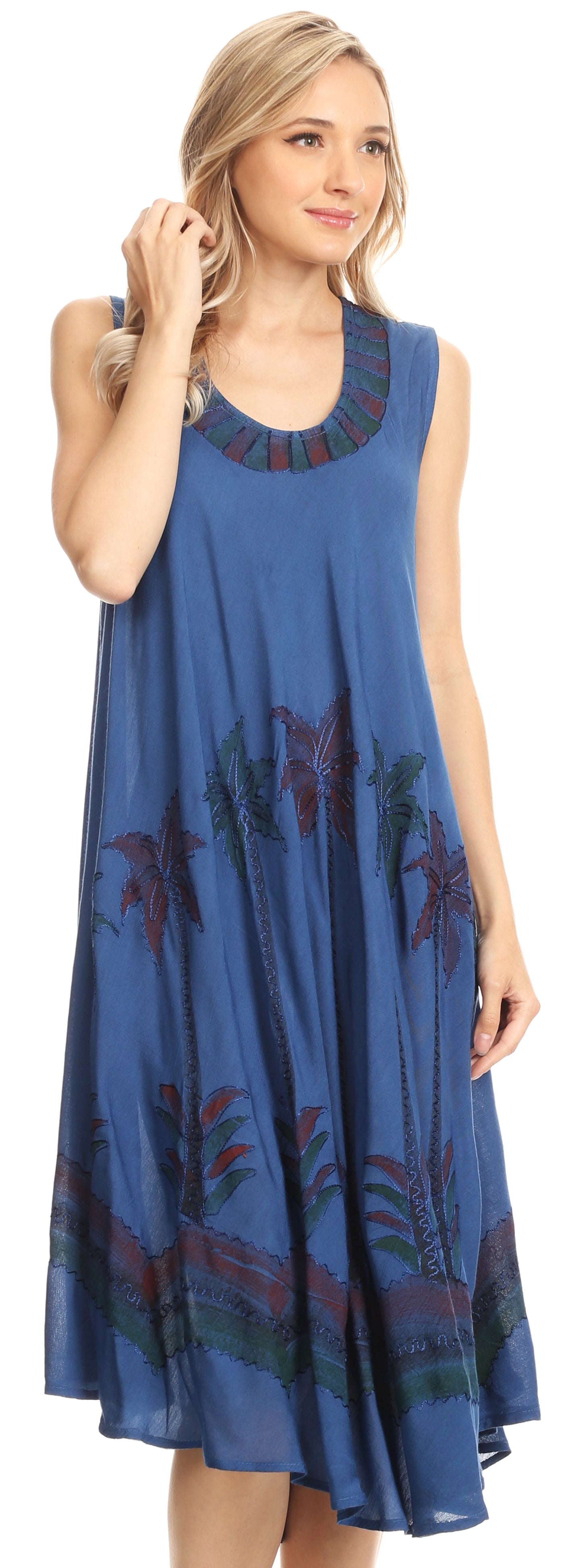 Woman wearing a blue dress with floral patterns on a white background