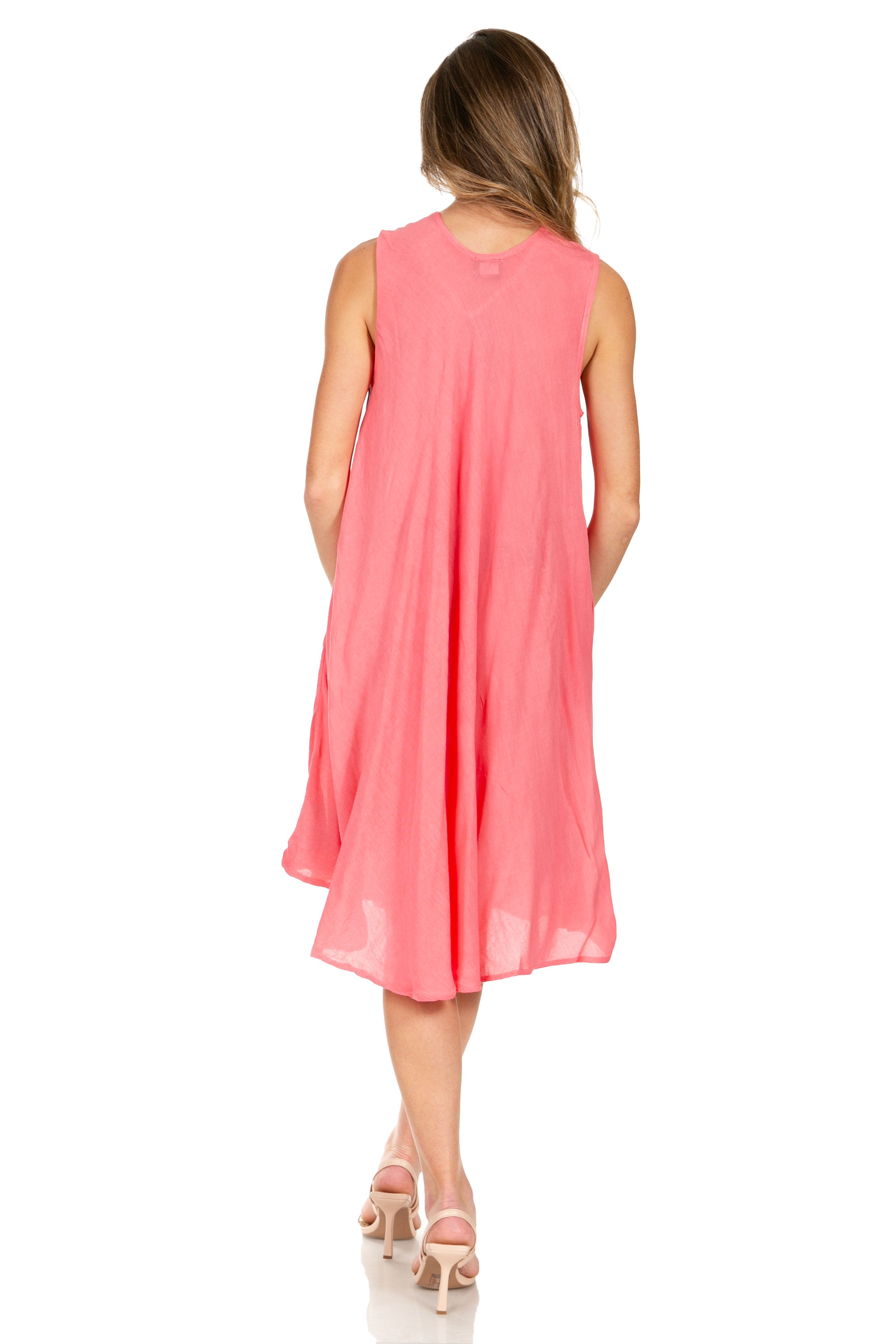 Woman wearing a pink sleeveless dress on a white background