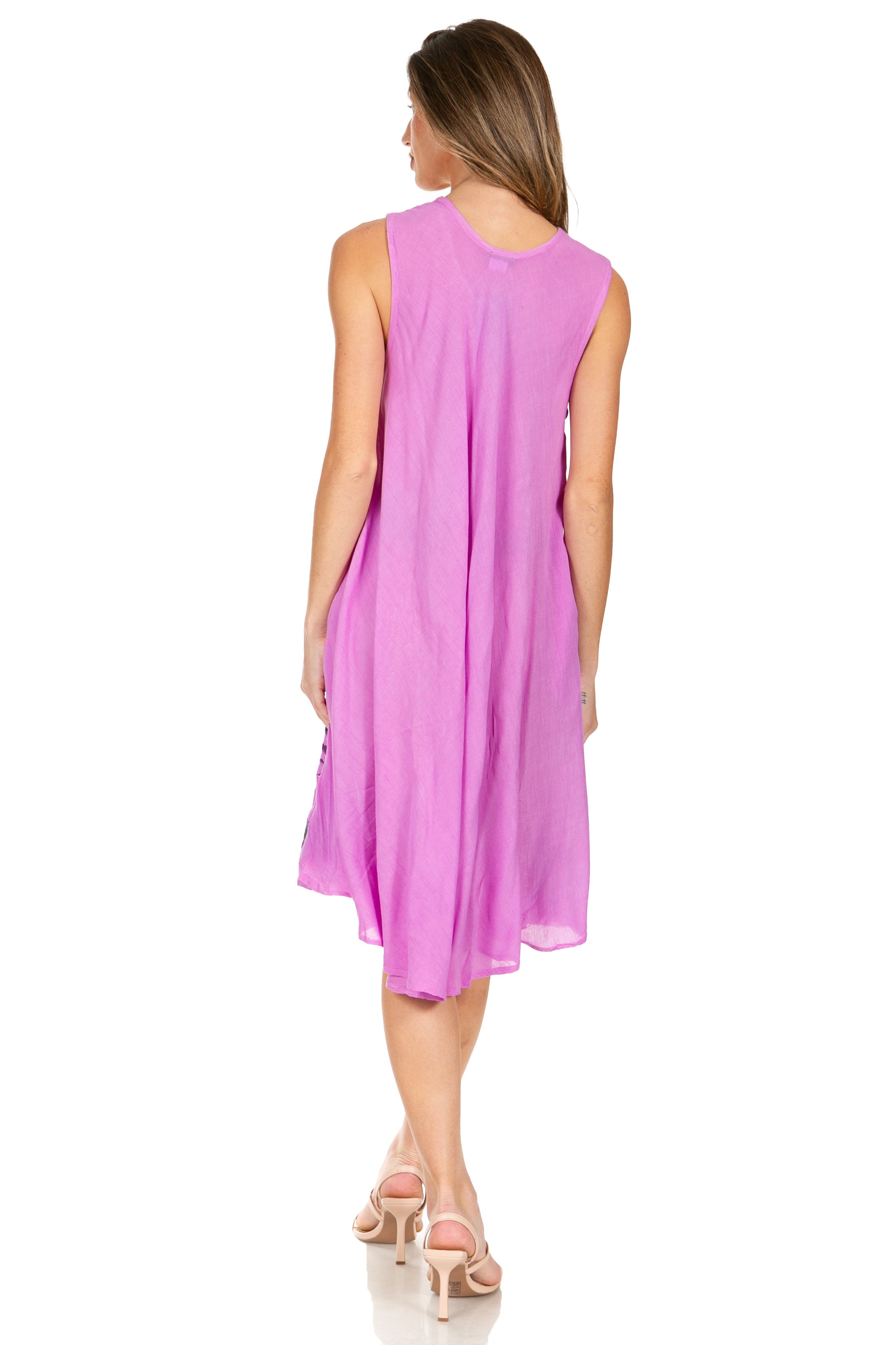 Woman wearing a pink sleeveless dress on a white background