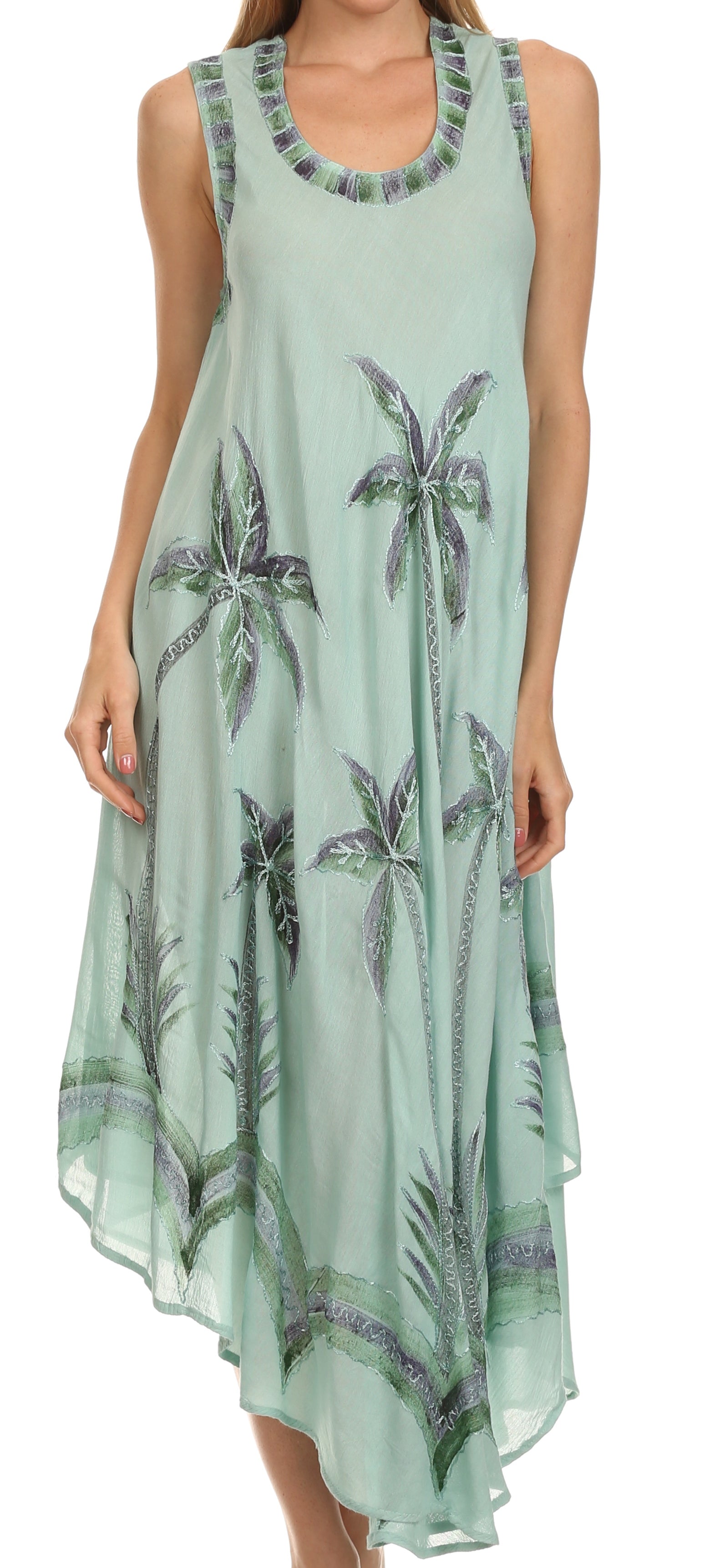 Light green dress with palm tree pattern on a white background