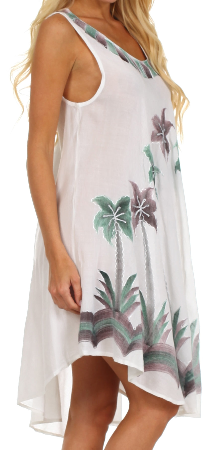 White dress with tropical plant pattern worn by a person