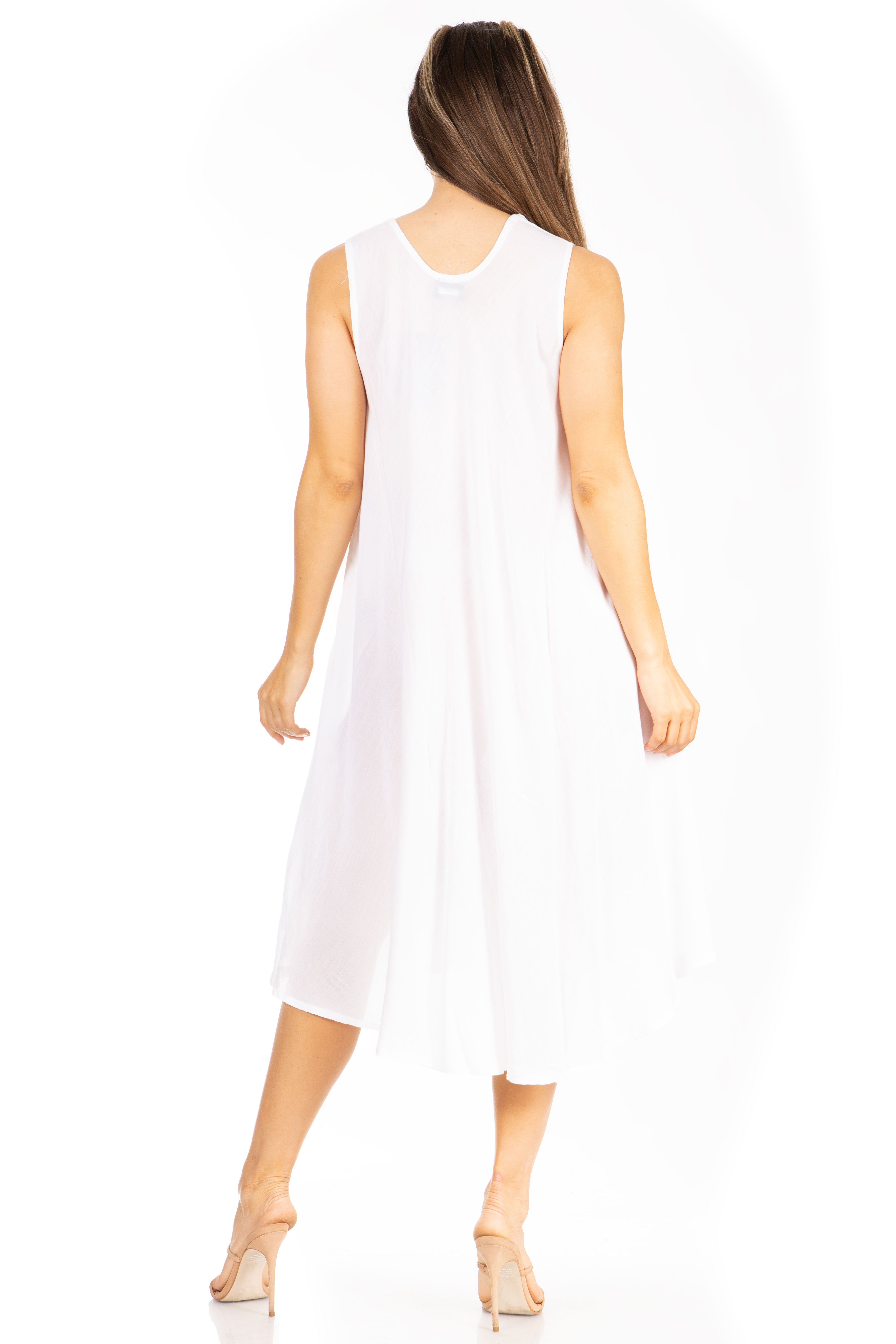 Woman wearing a white sleeveless dress on a white background