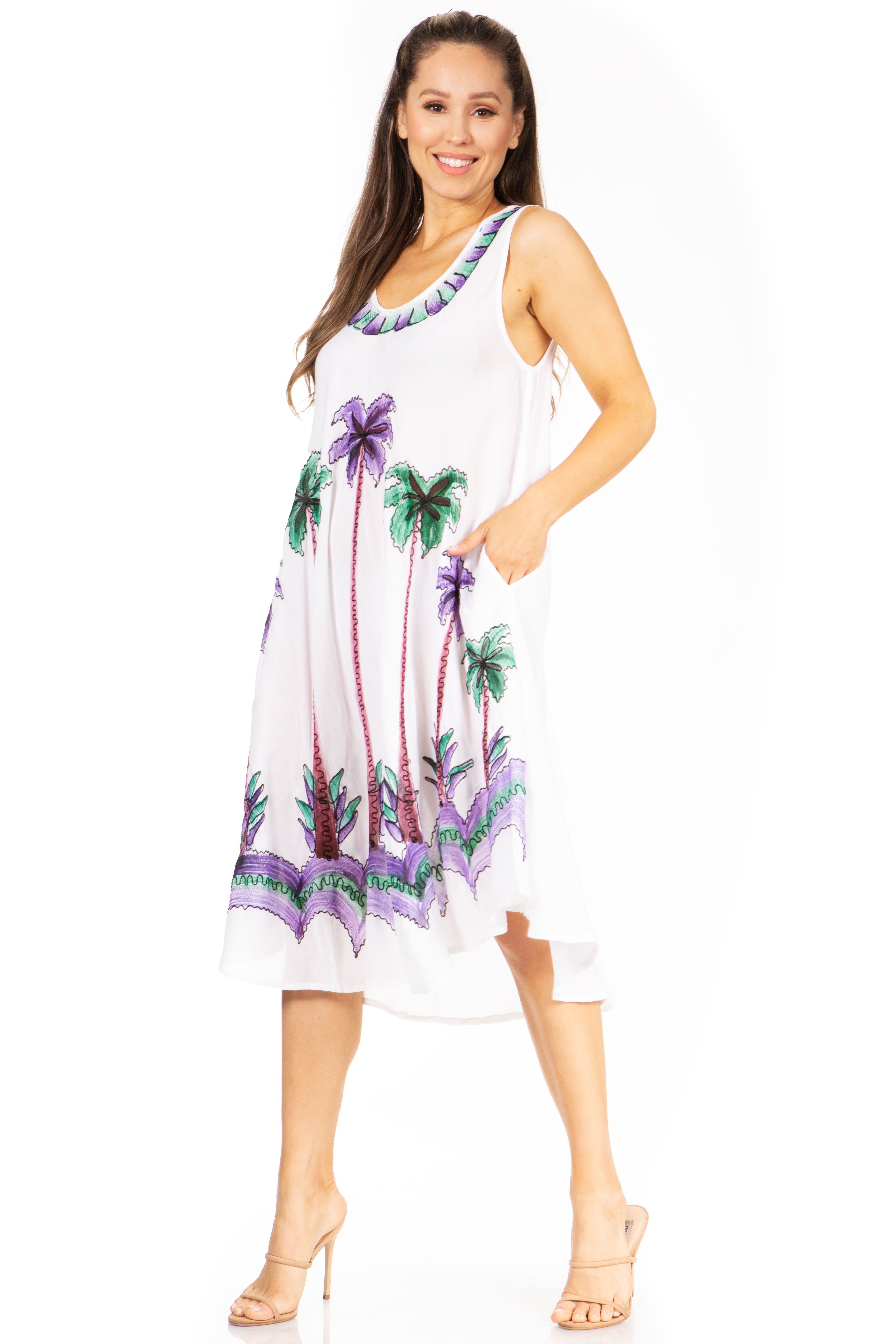 Woman wearing a white dress with palm tree and flower patterns on a white background
