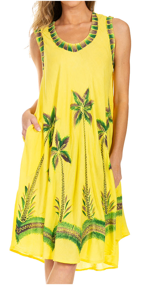 Yellow dress with green leaf patterns on a white background