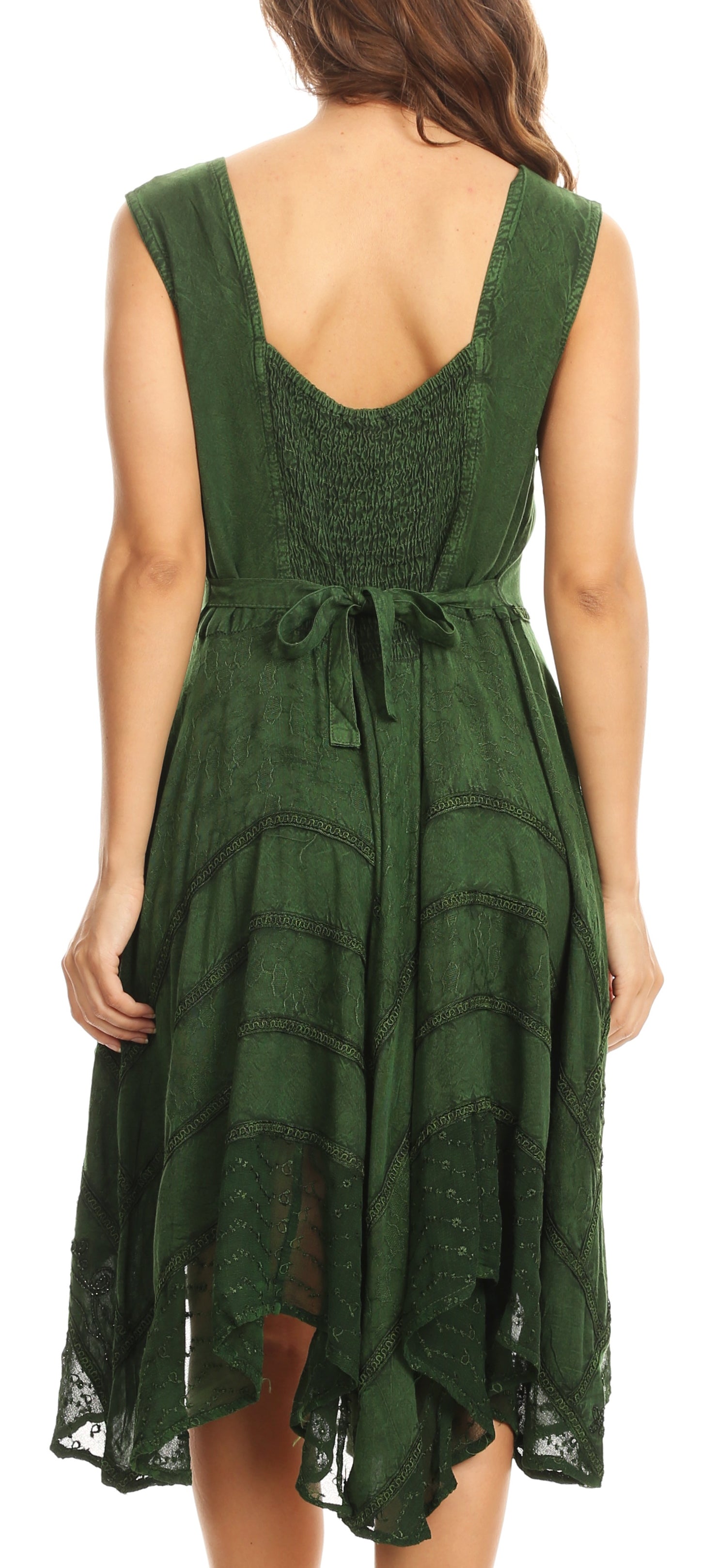 Green dress with open back worn by a person on a white background