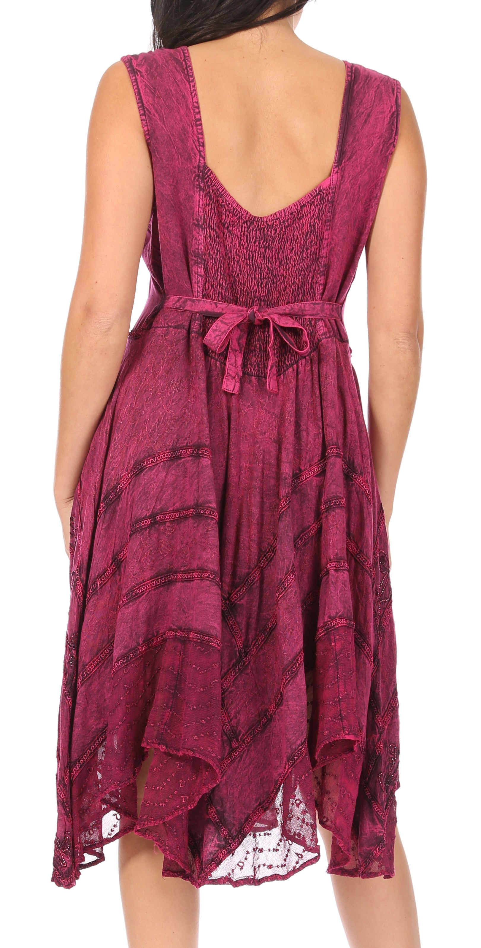 Woman wearing a burgundy patterned dress on a white background