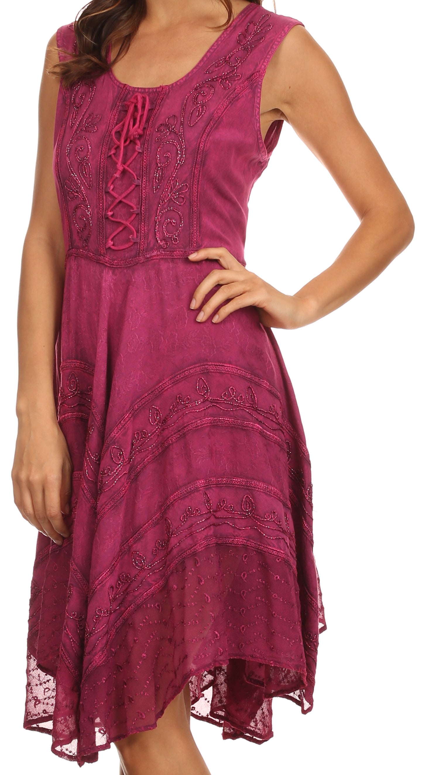 Woman wearing a sleeveless, patterned dress on a white background