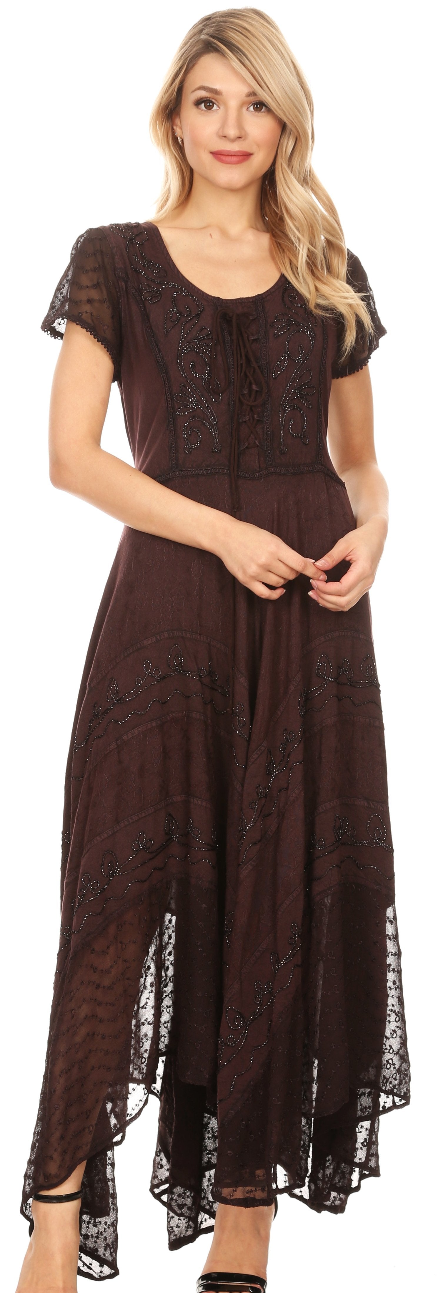 Woman wearing a long brown dress with lace details on a white background