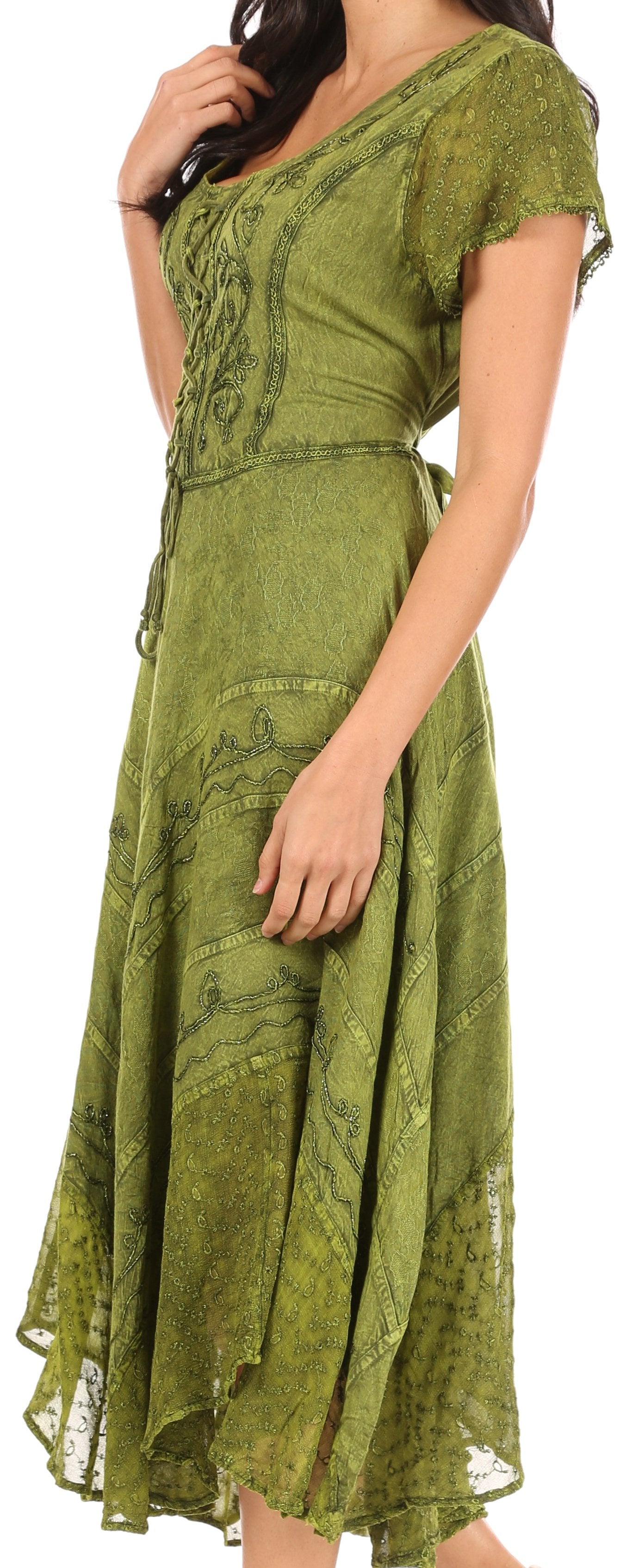Woman wearing a green lace dress with a plain background
