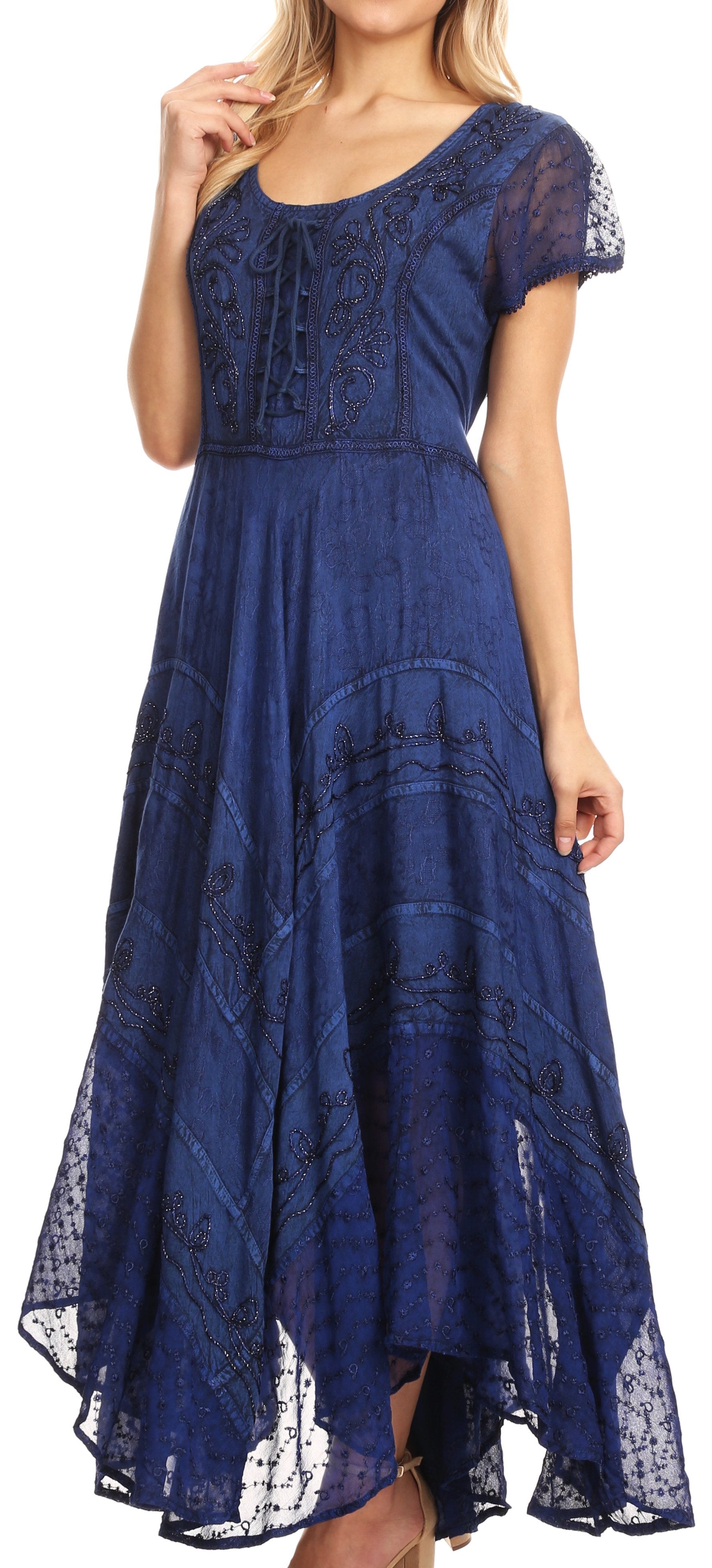 Woman wearing a blue lace dress against a white background