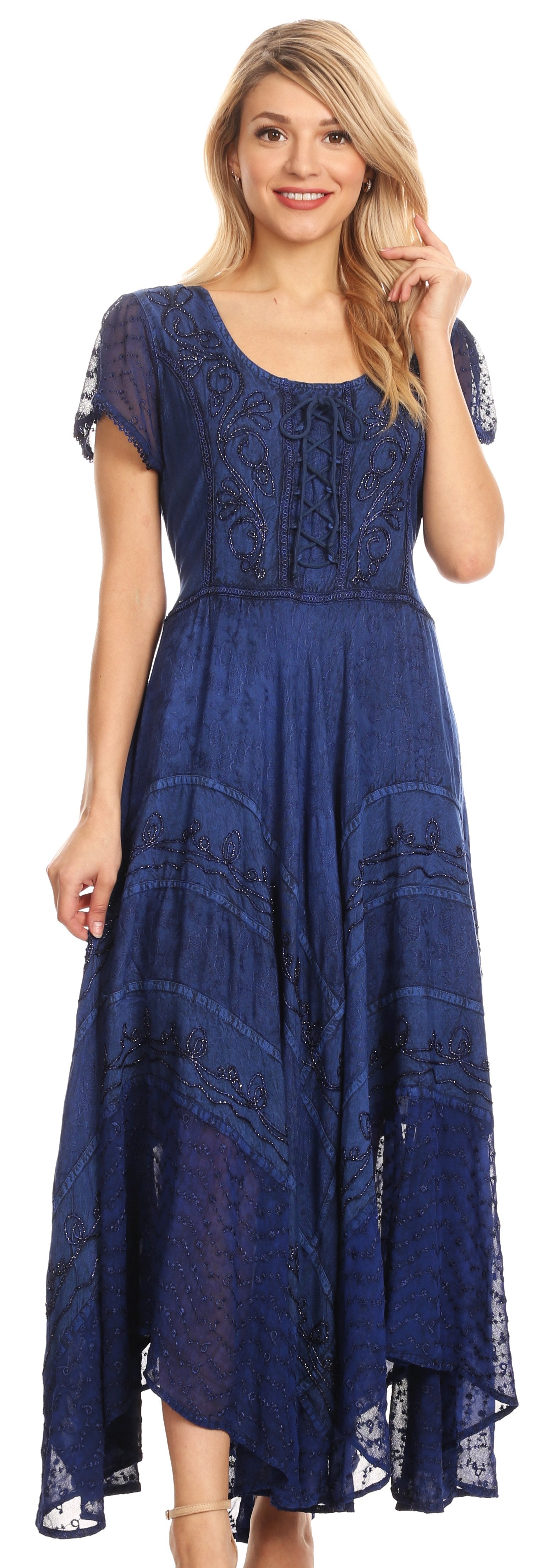 Woman wearing a blue lace dress against a white background