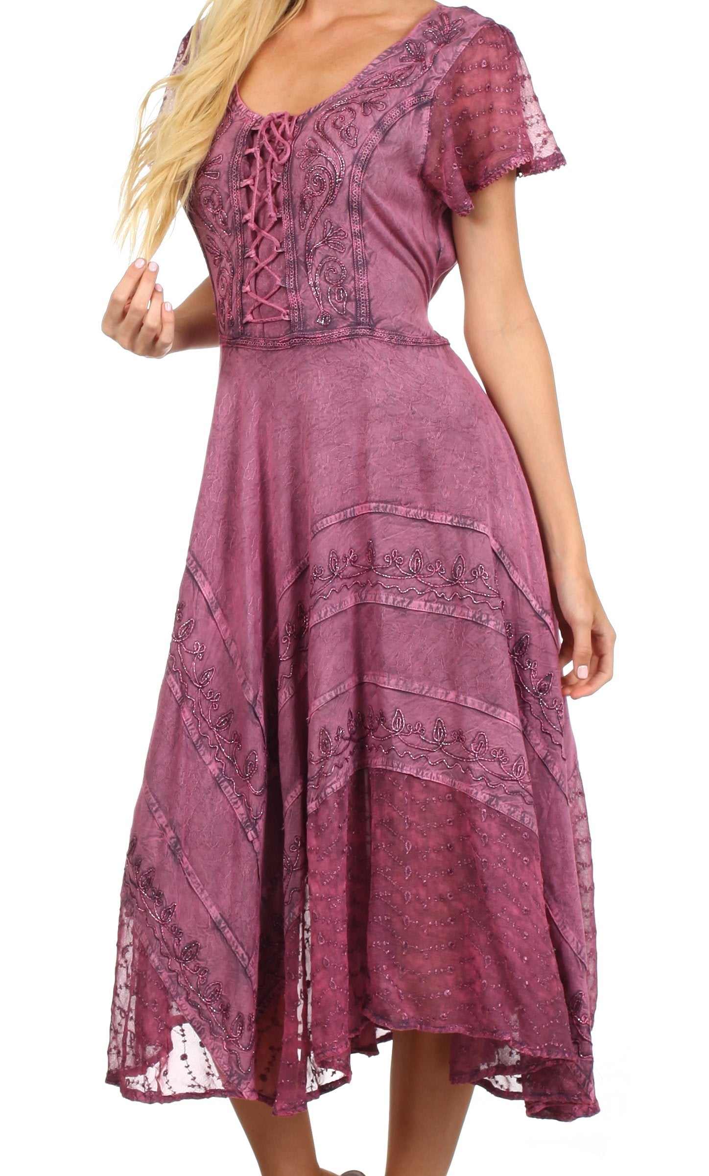 Woman wearing a purple patterned dress on a white background