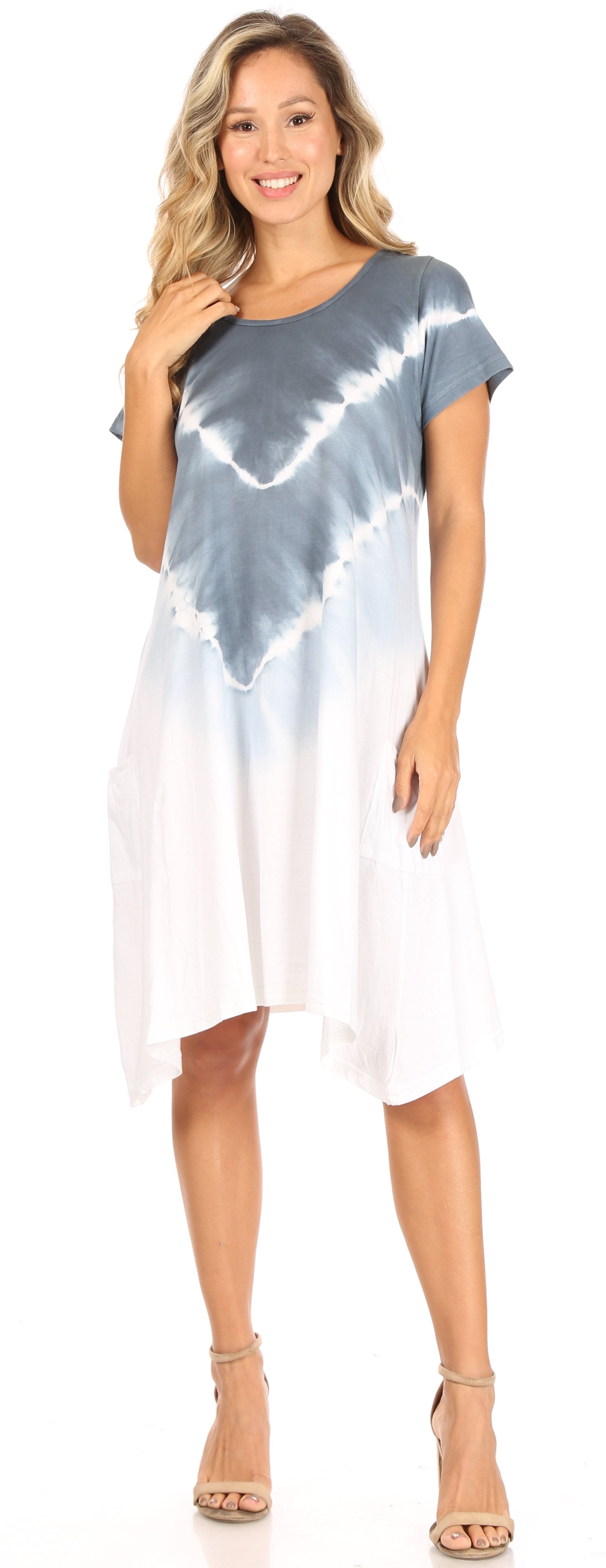 Woman wearing a tie-dye dress with a white background